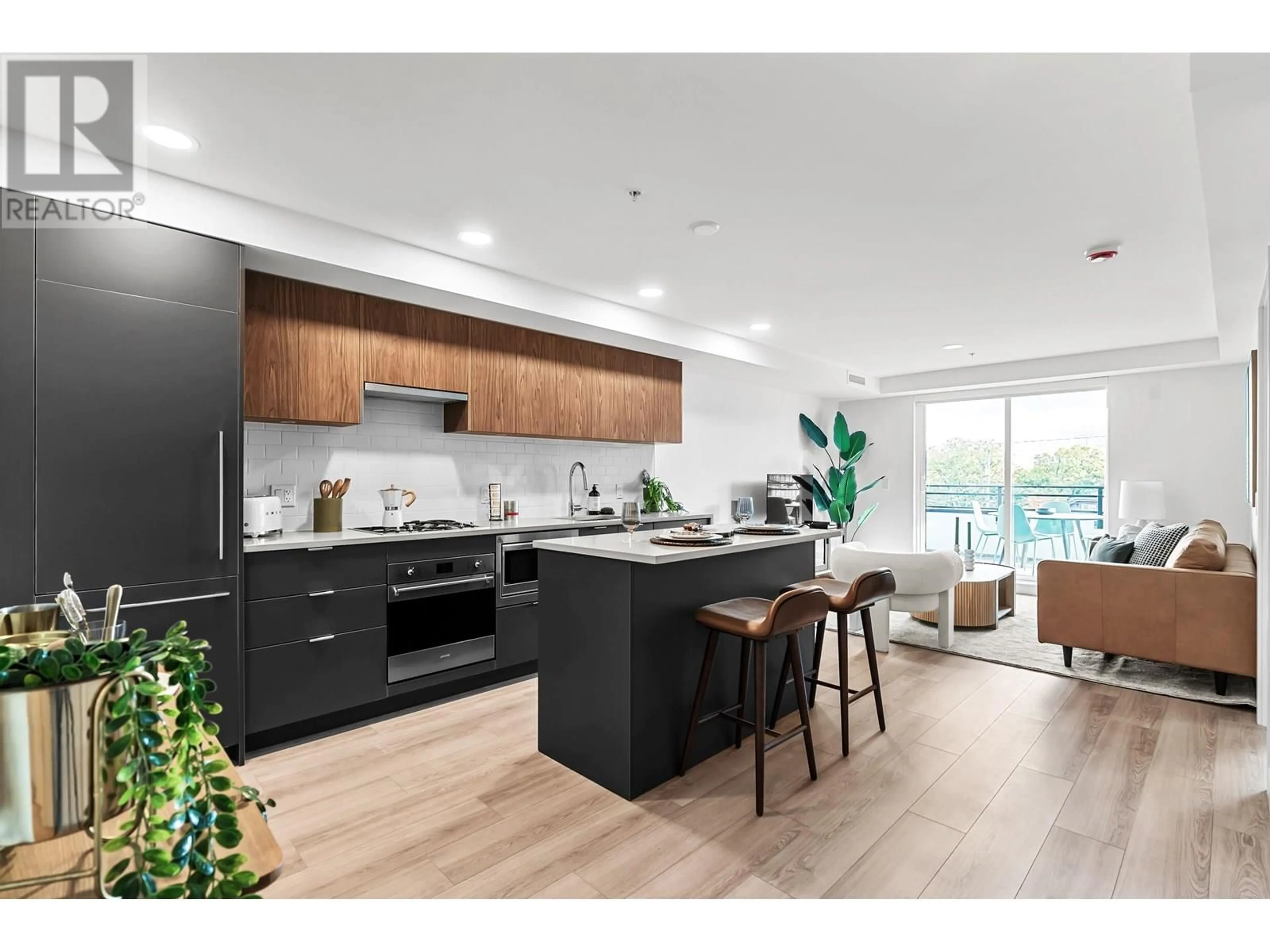 Open concept kitchen, wood/laminate floor for 101 - 2419 GRANT STREET, Vancouver British Columbia V0V0V0