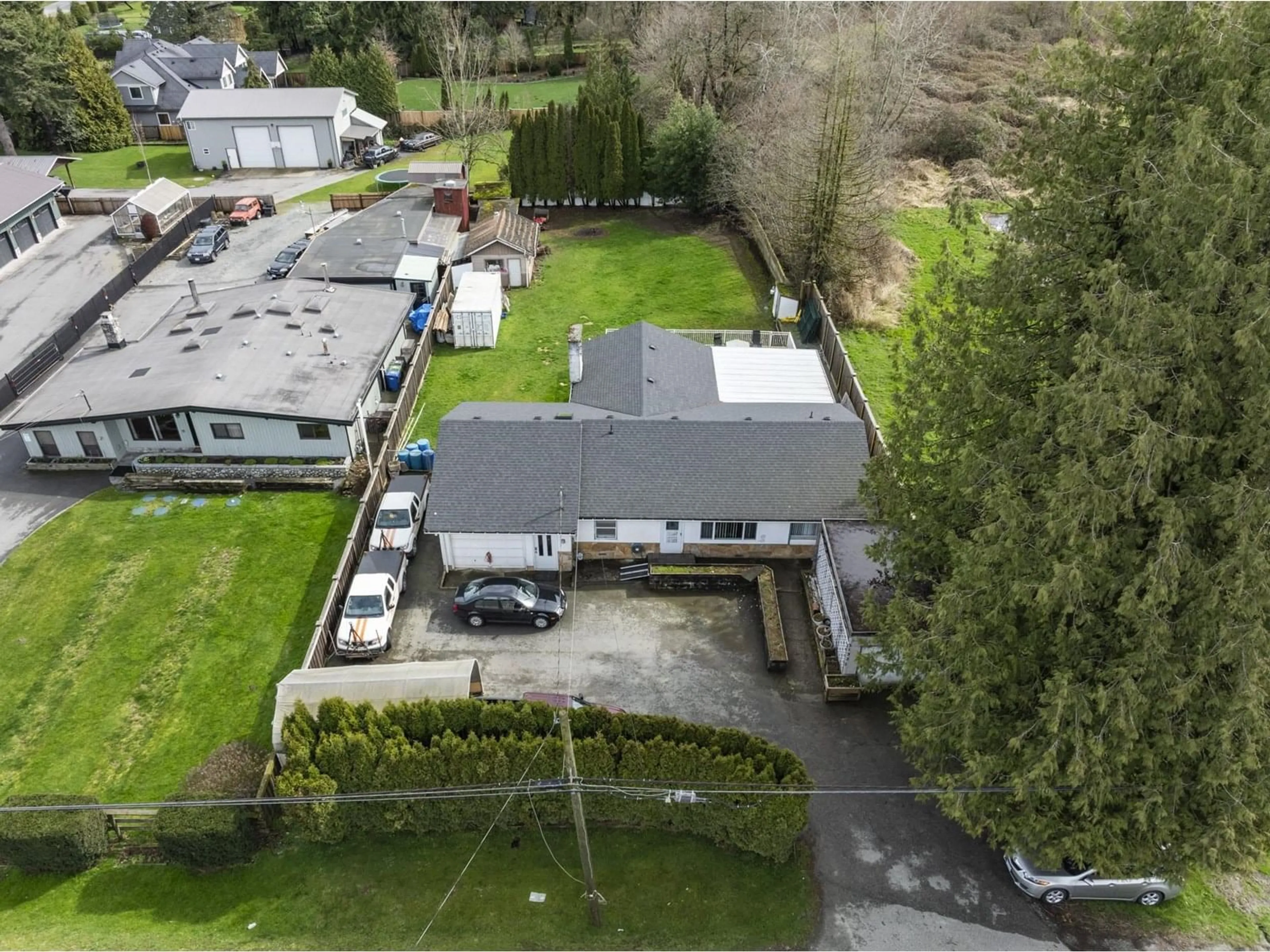 A pic from outside/outdoor area/front of a property/back of a property/a pic from drone, street for 3132 BRADNER, Abbotsford British Columbia V4X1K2