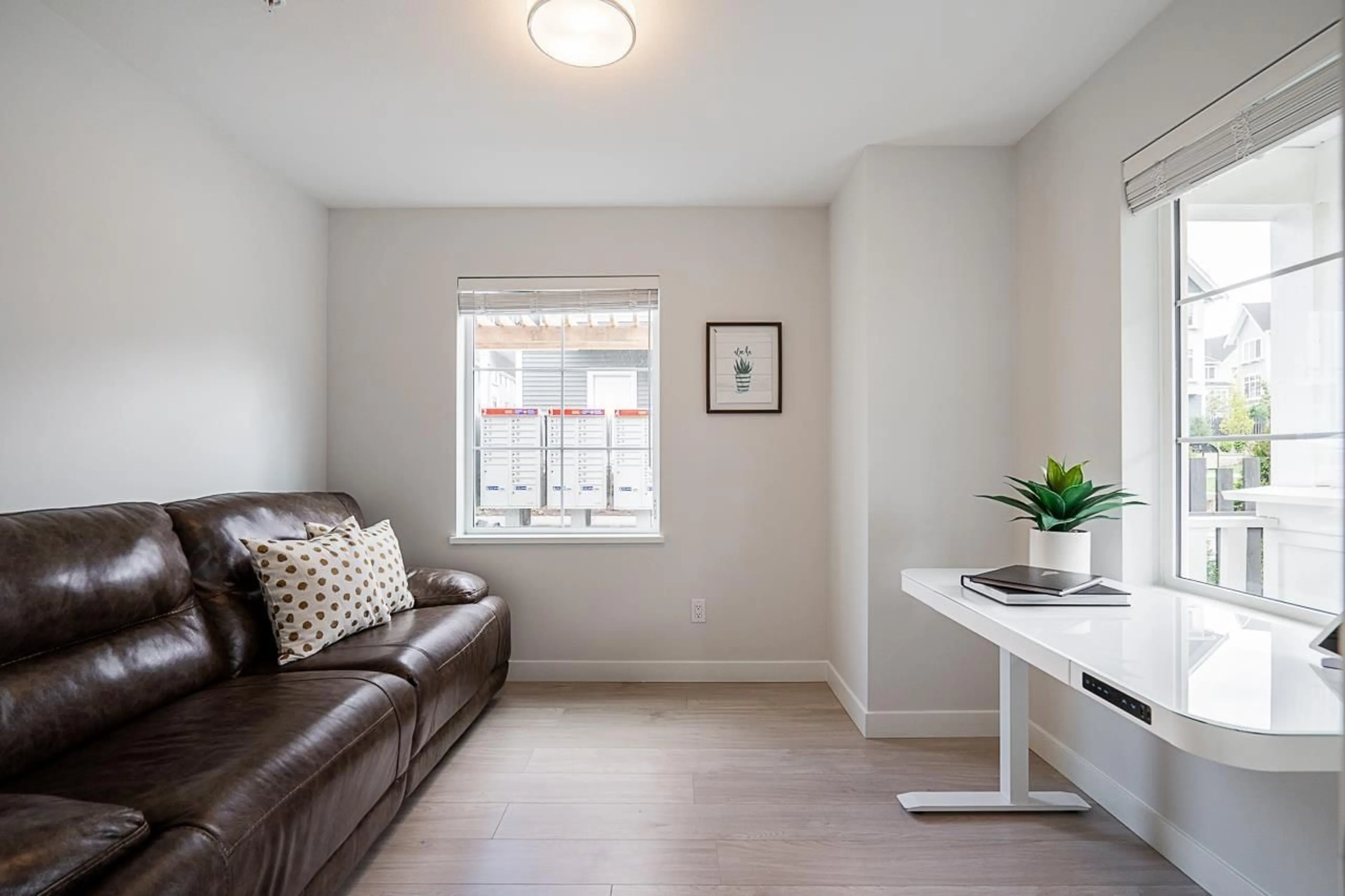 Living room with furniture, wood/laminate floor for 121 - 20180 84, Langley British Columbia V2Y3N5