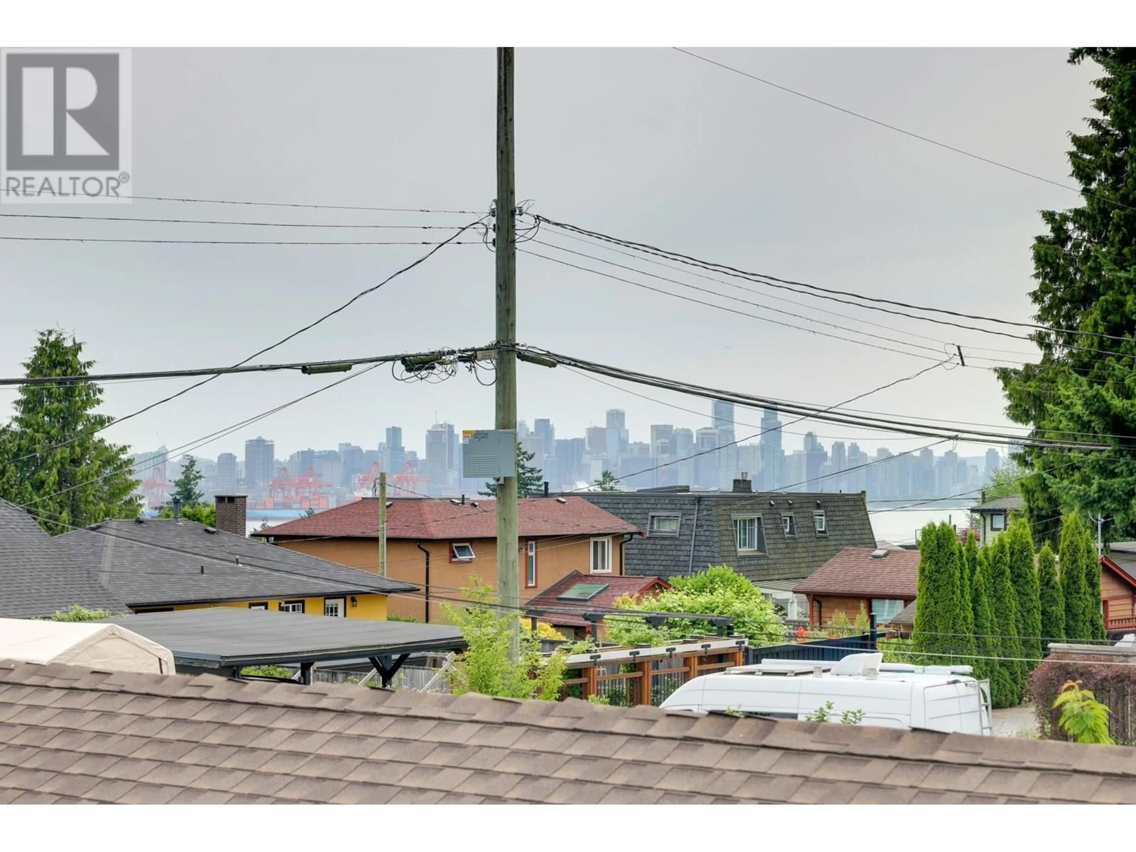 Patio, city buildings view from balcony for 529 7TH STREET, North Vancouver British Columbia V7L1S2