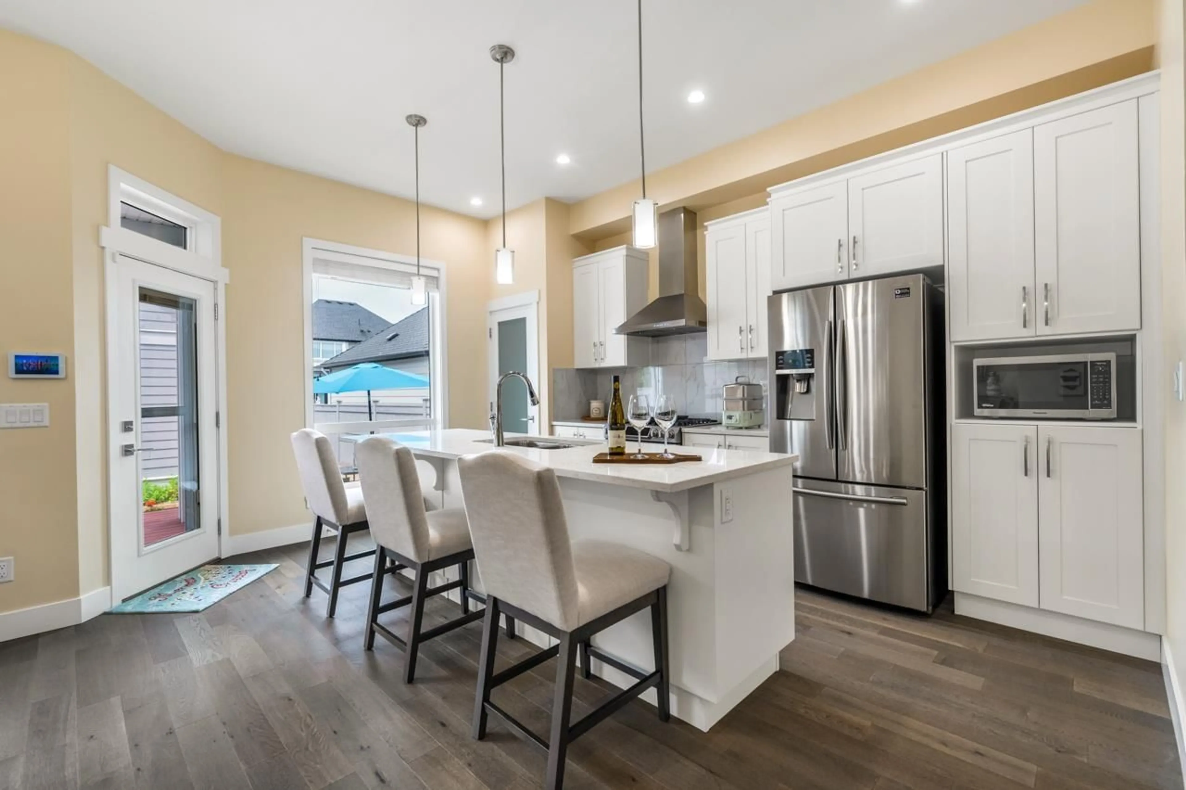 Open concept kitchen, wood/laminate floor for 2509 164A, Surrey British Columbia V3Z0S2