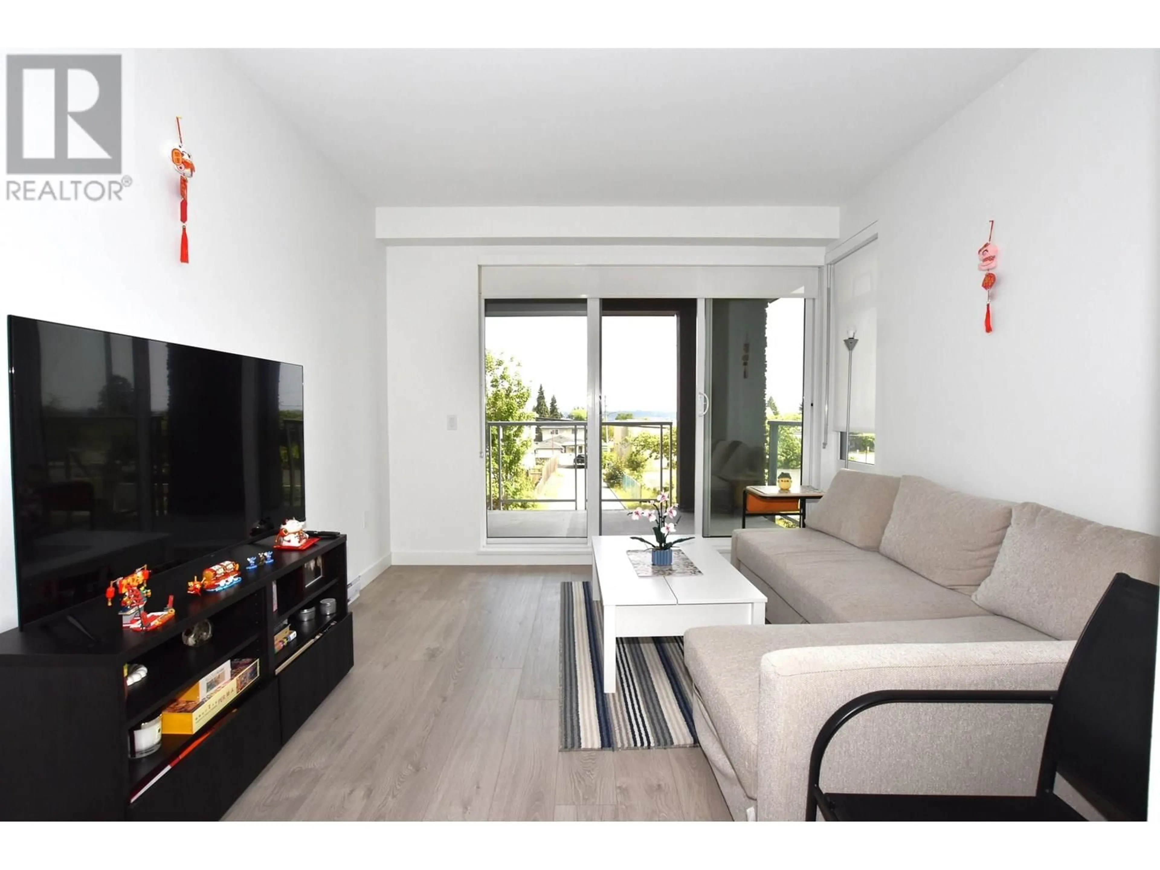 Living room with furniture, wood/laminate floor for 202 - 7123 11TH AVENUE, Burnaby British Columbia V3N0J6