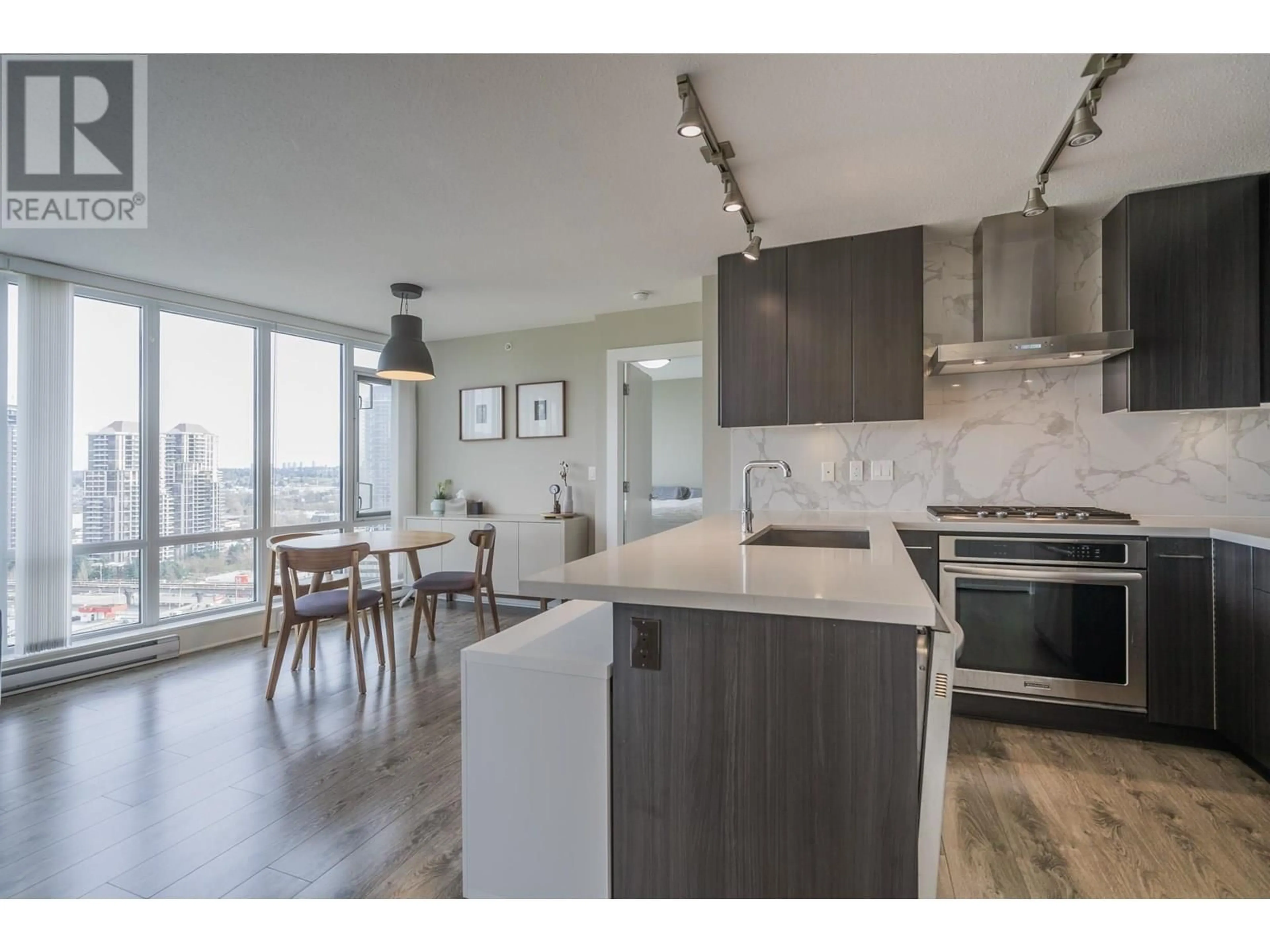 Open concept kitchen, wood/laminate floor for 2009 - 4189 HALIFAX STREET, Burnaby British Columbia V5C0H9