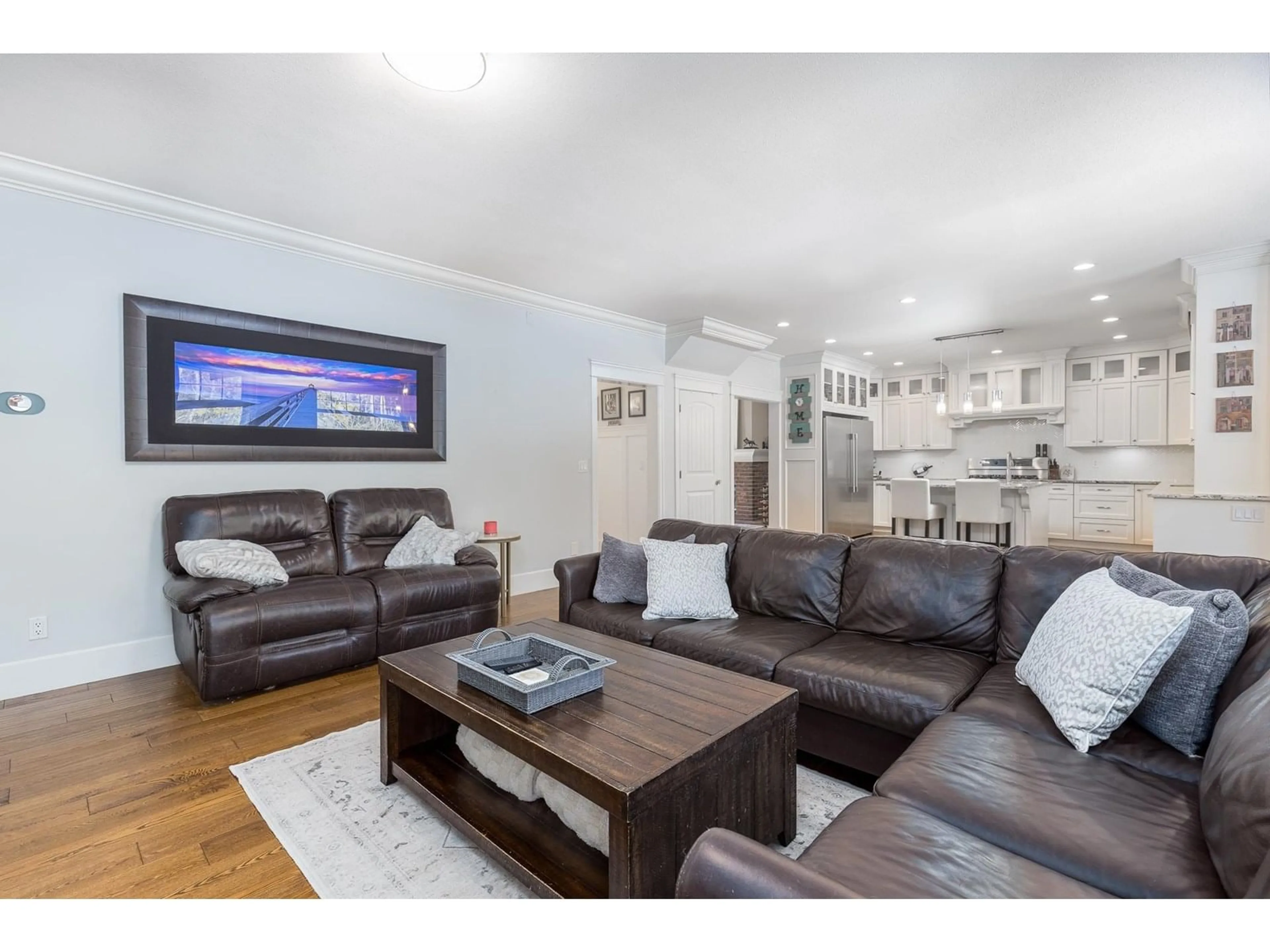 Living room with furniture, wood/laminate floor for 23923 36A, Langley British Columbia V2Z2J6