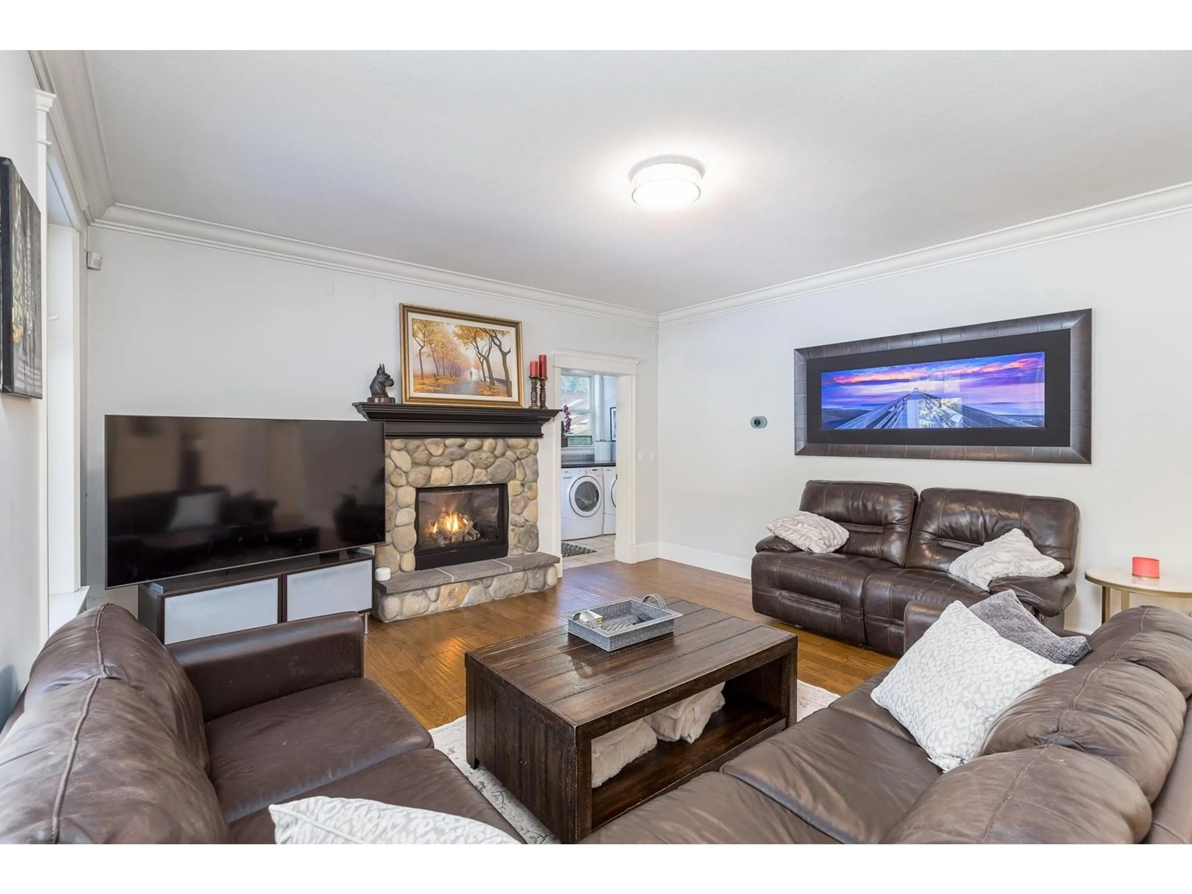 Living room with furniture, wood/laminate floor for 23923 36A, Langley British Columbia V2Z2J6