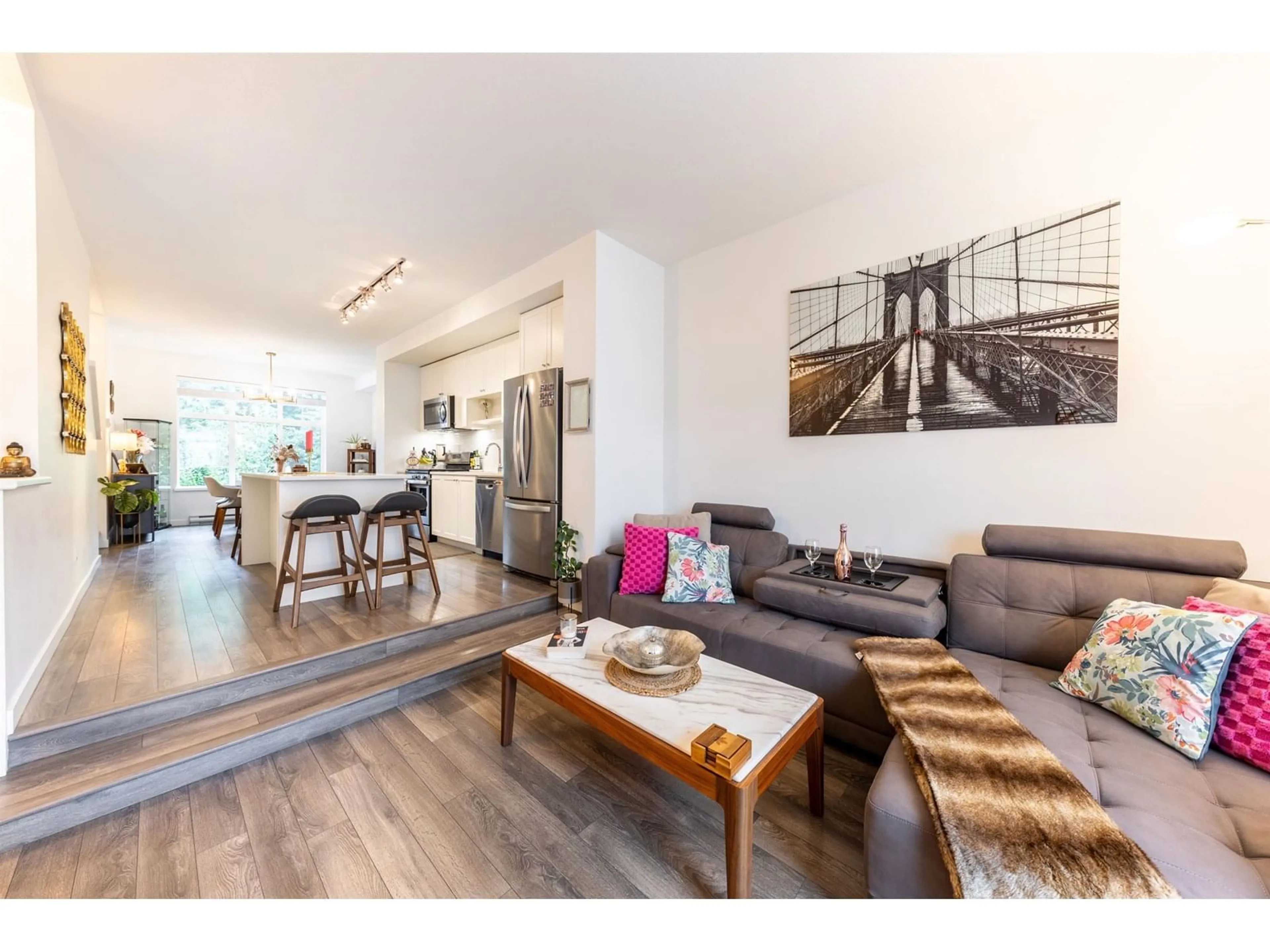 Living room with furniture, wood/laminate floor for 85 - 158 171, Surrey British Columbia V3Z0X1