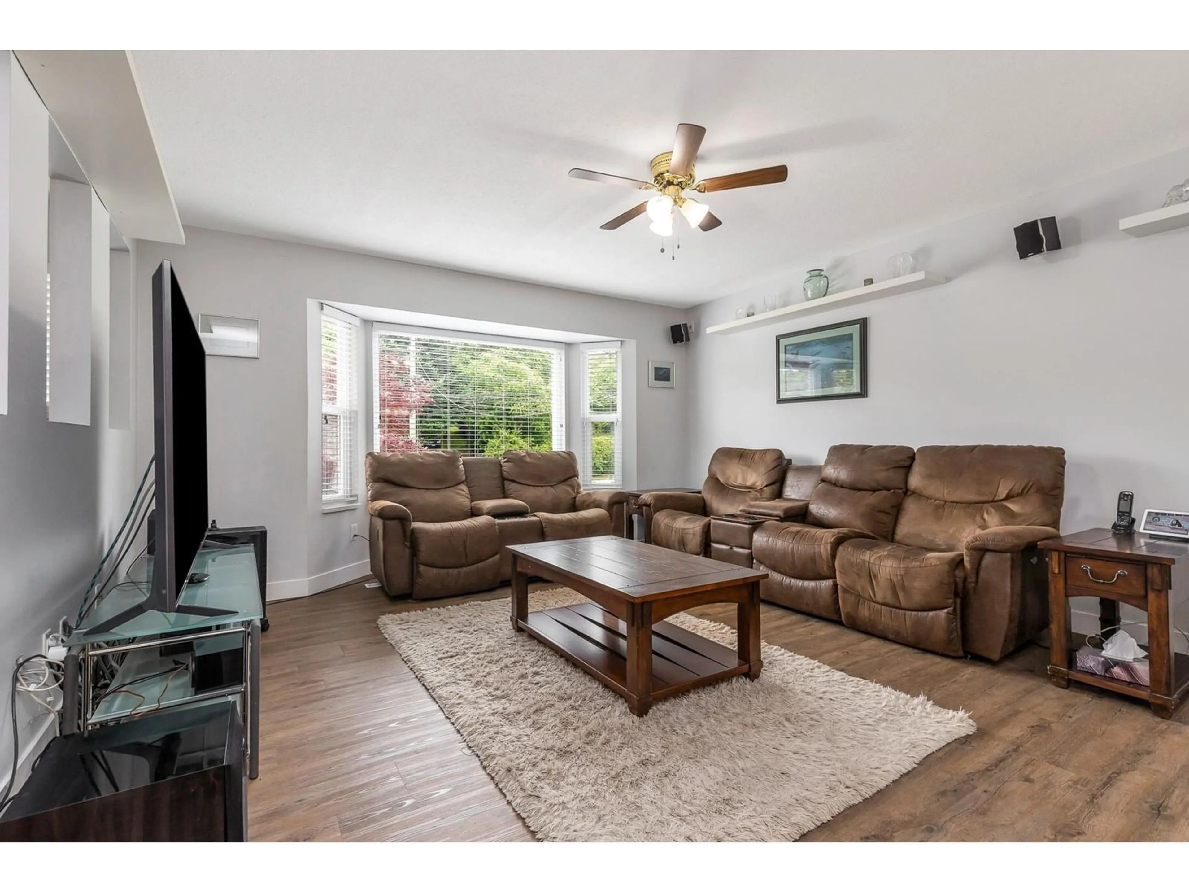 Living room with furniture, wood/laminate floor for 32456 14TH, Mission British Columbia V2V2N7