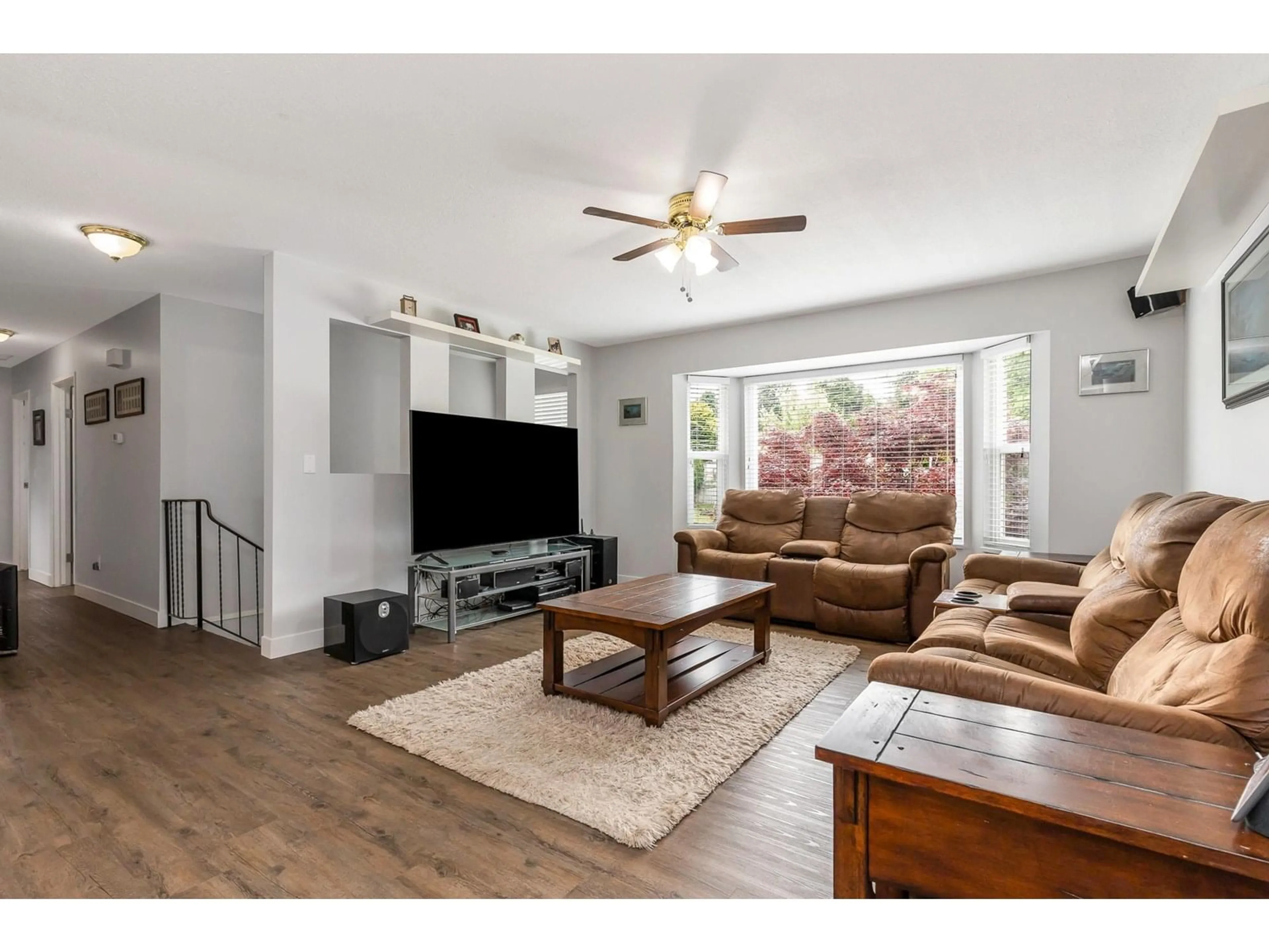 Living room with furniture, wood/laminate floor for 32456 14TH, Mission British Columbia V2V2N7