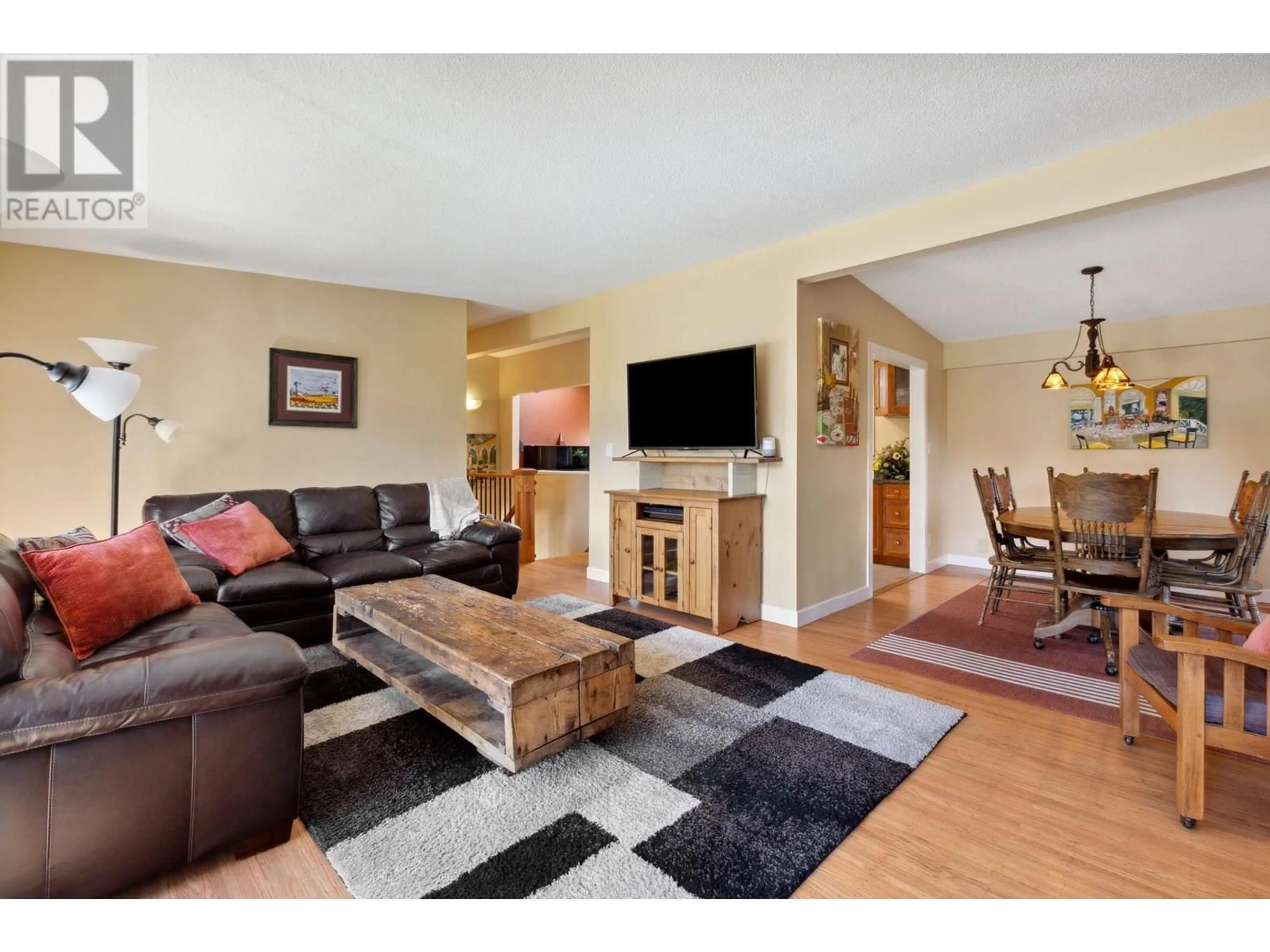 Living room with furniture, wood/laminate floor for 2591 BELLOC STREET, North Vancouver British Columbia V7H1H9