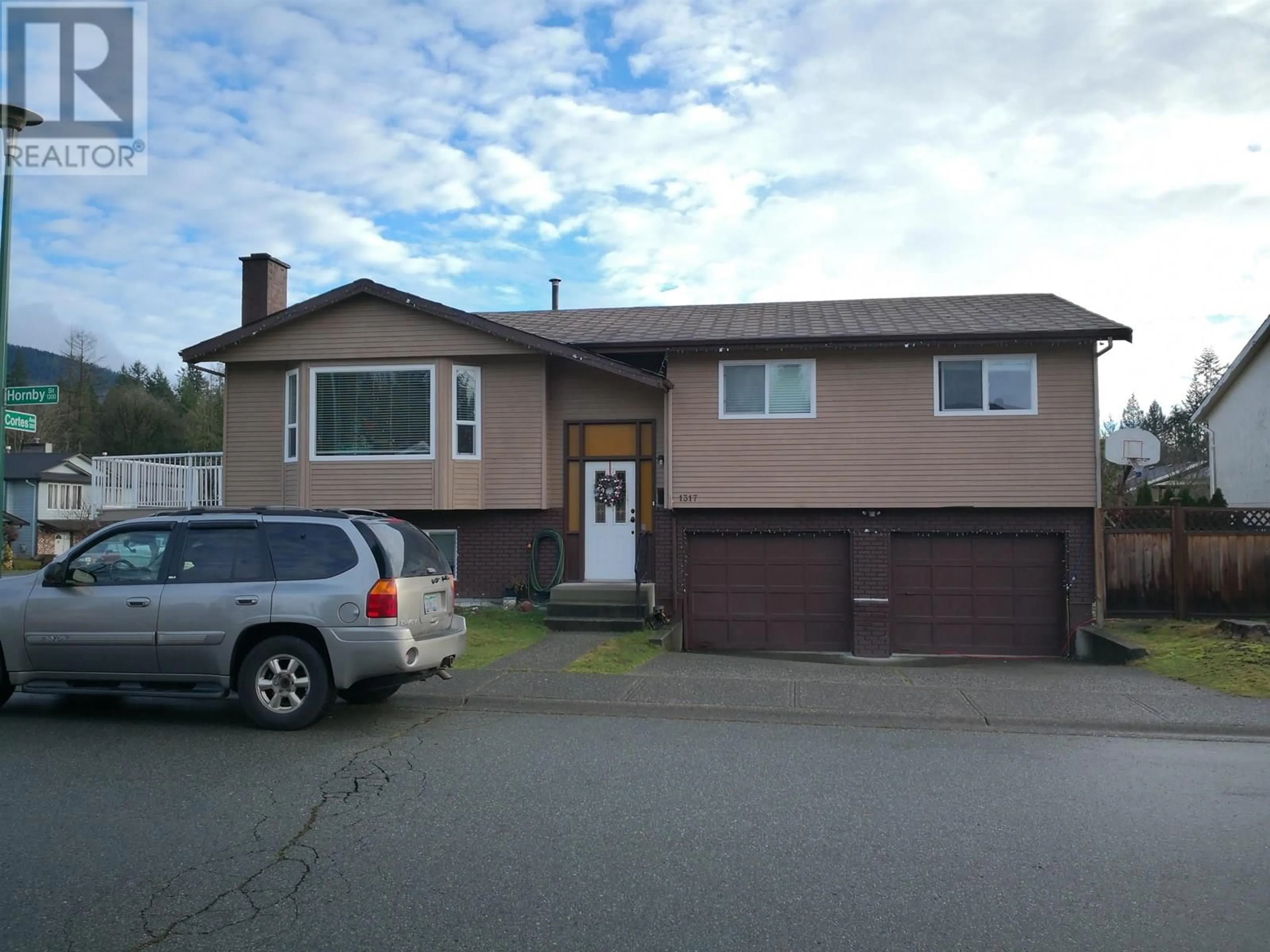 Home with vinyl exterior material, street for 1317 HORNBY STREET, Coquitlam British Columbia V3E1V3