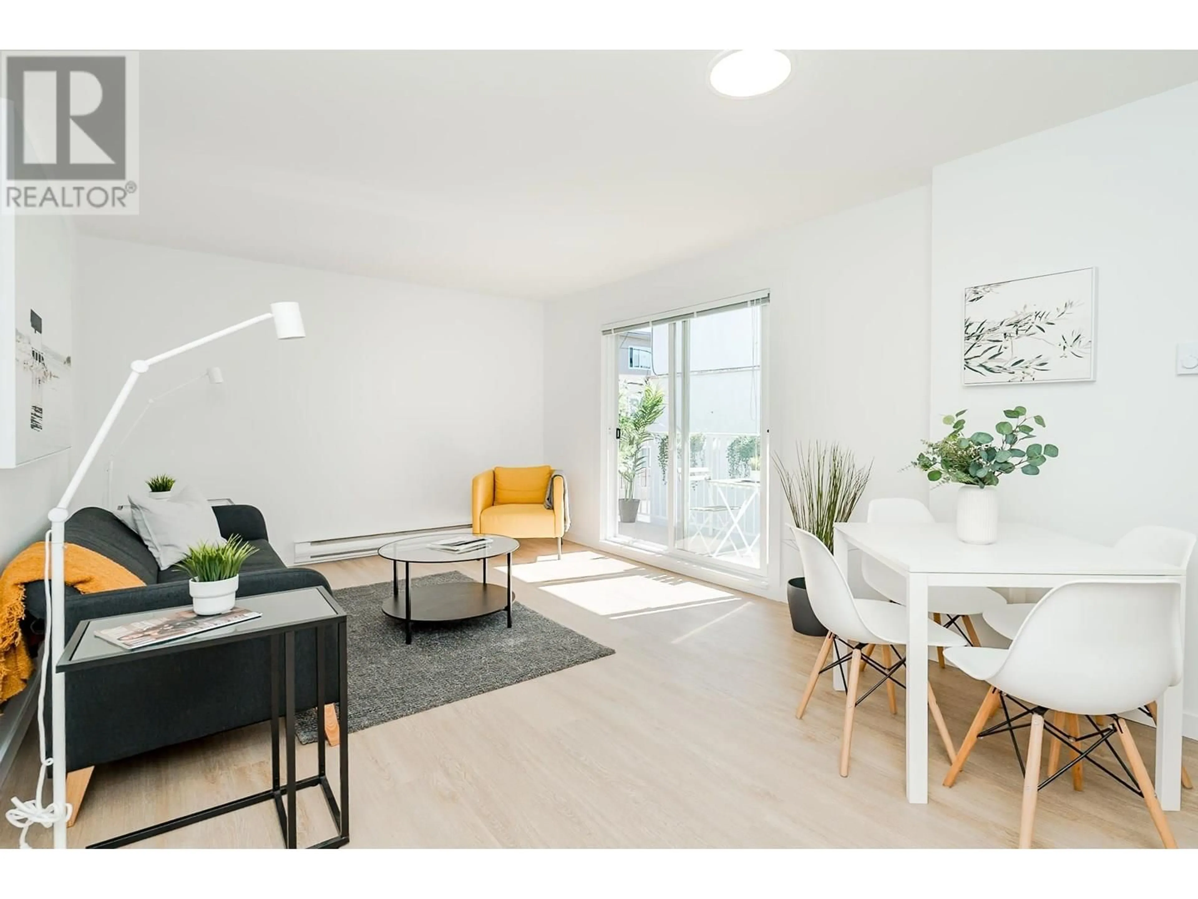 Living room with furniture, wood/laminate floor for 202 - 8690 MONTCALM STREET, Vancouver British Columbia V6P4P8