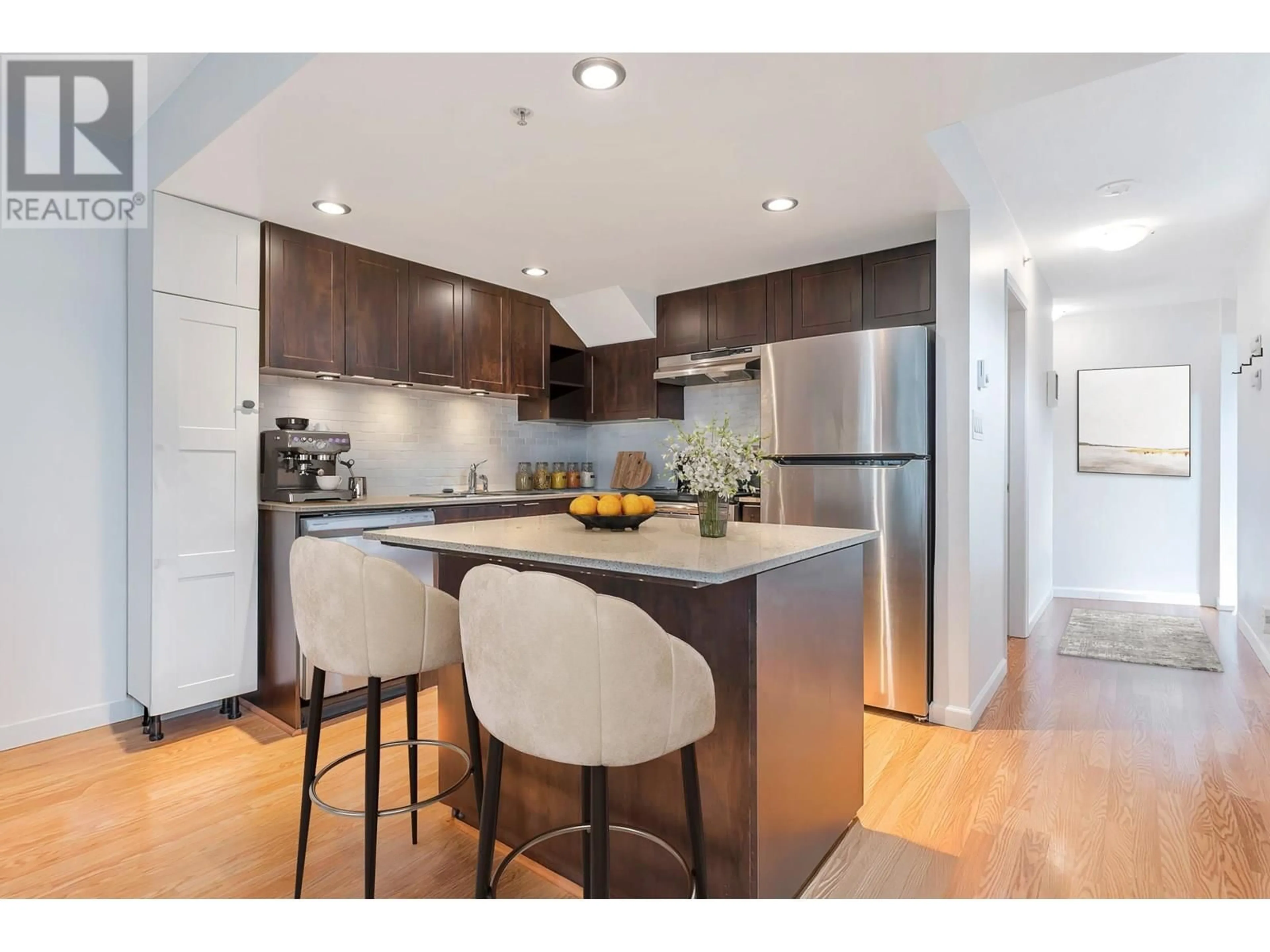 Open concept kitchen, wood/laminate floor for 9234 UNIVERSITY CRESCENT, Burnaby British Columbia V5A0A3