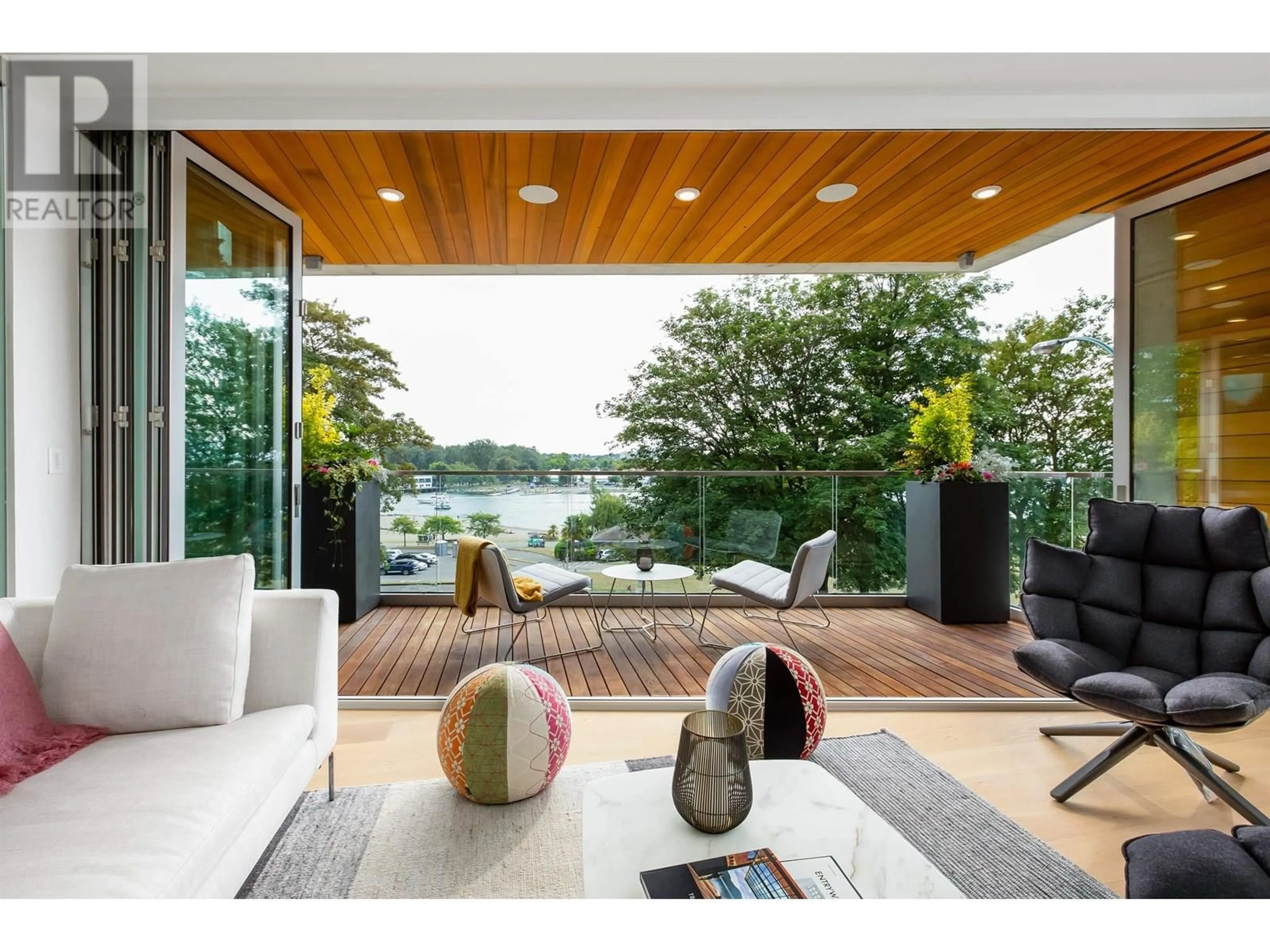Living room with furniture, wood/laminate floor for 201 - 1460 BUTE STREET, Vancouver British Columbia V6E2A7