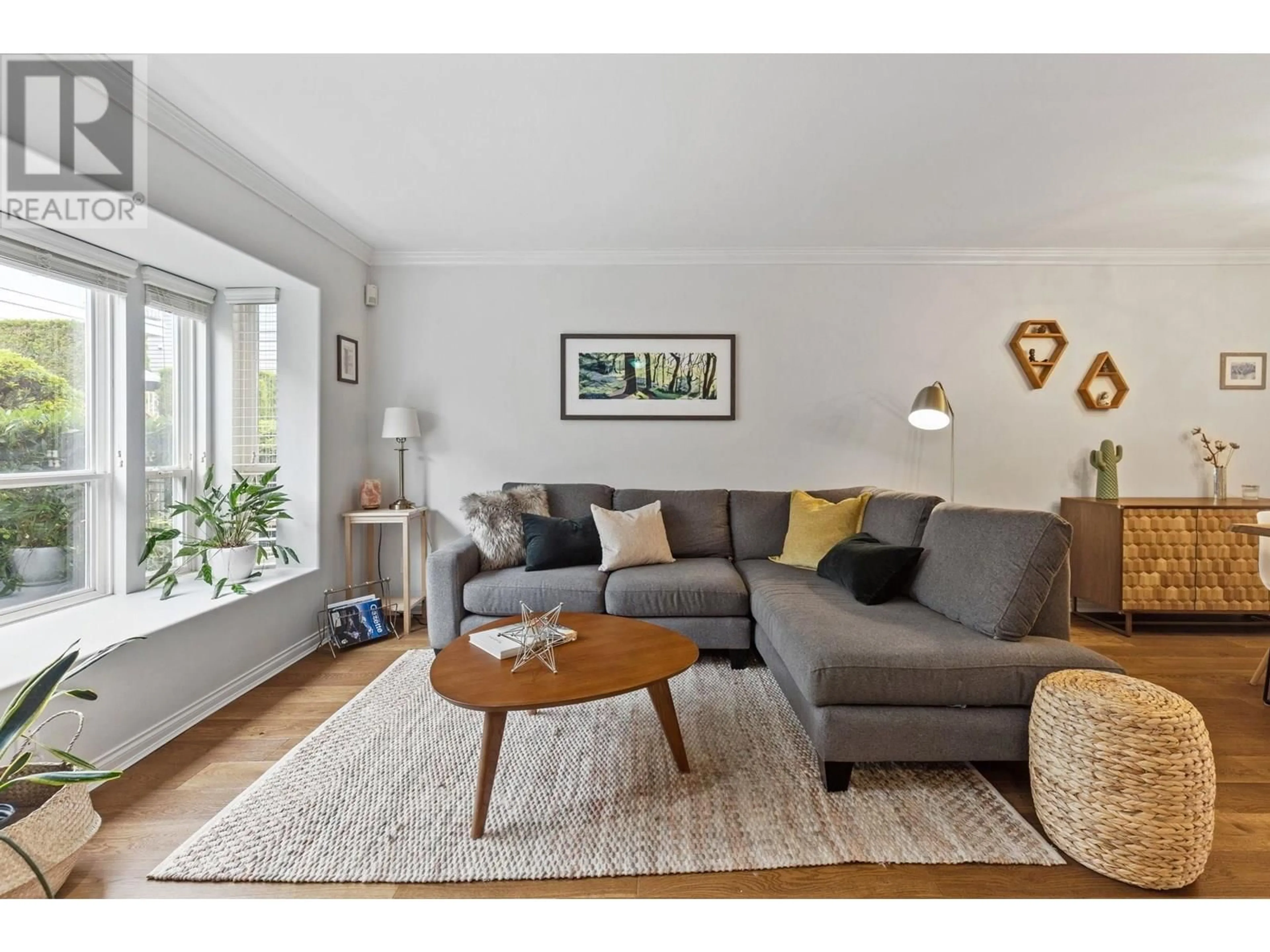 Living room with furniture, wood/laminate floor for 112 - 225 6TH STREET, North Vancouver British Columbia V7L1P4