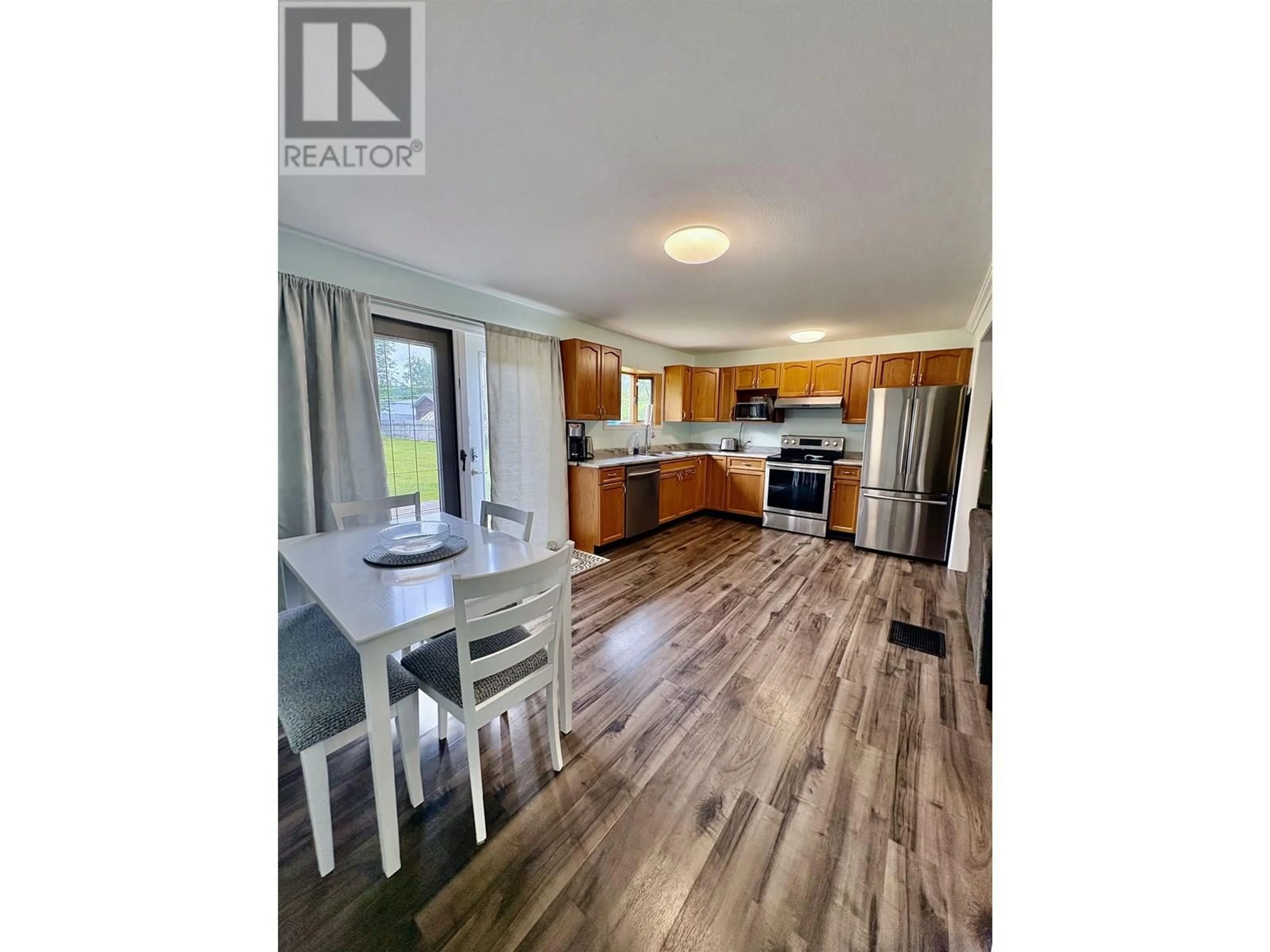 Open concept kitchen, wood/laminate floor for 2552 PENNER STREET, Terrace British Columbia V8G5A4