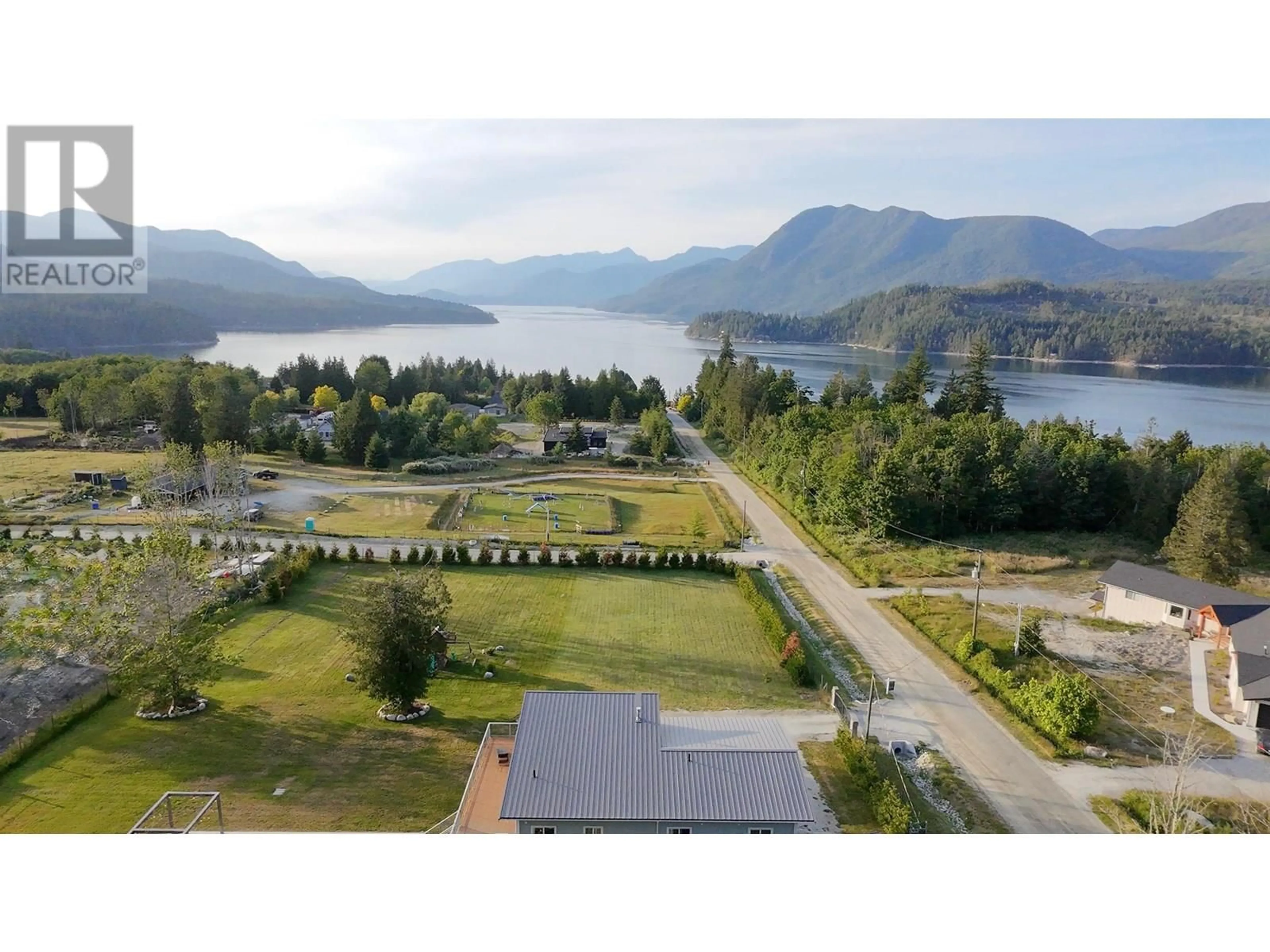 A pic from outside/outdoor area/front of a property/back of a property/a pic from drone, water/lake/river/ocean view for 6315 RIMROCK ROAD, Sechelt British Columbia V7Z0L1