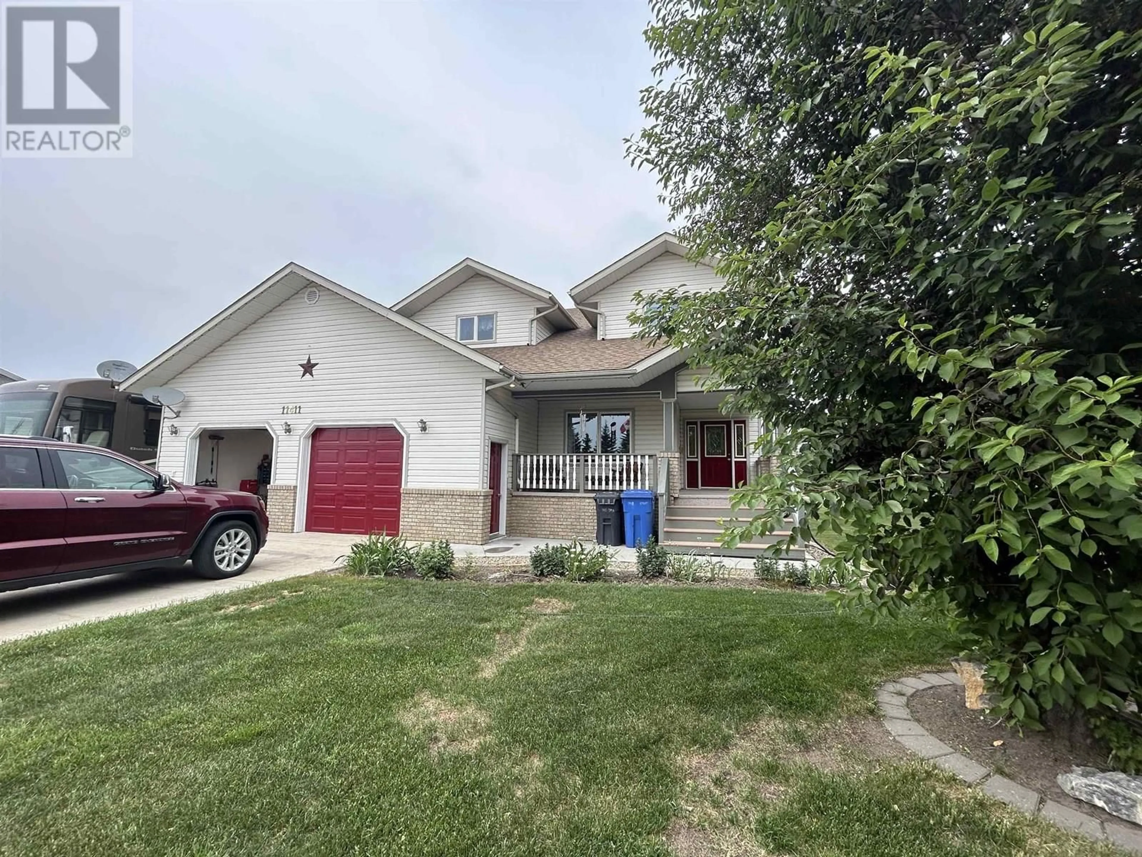 A pic from outside/outdoor area/front of a property/back of a property/a pic from drone, street for 11411 109 STREET, Fort St. John British Columbia V1J6W3