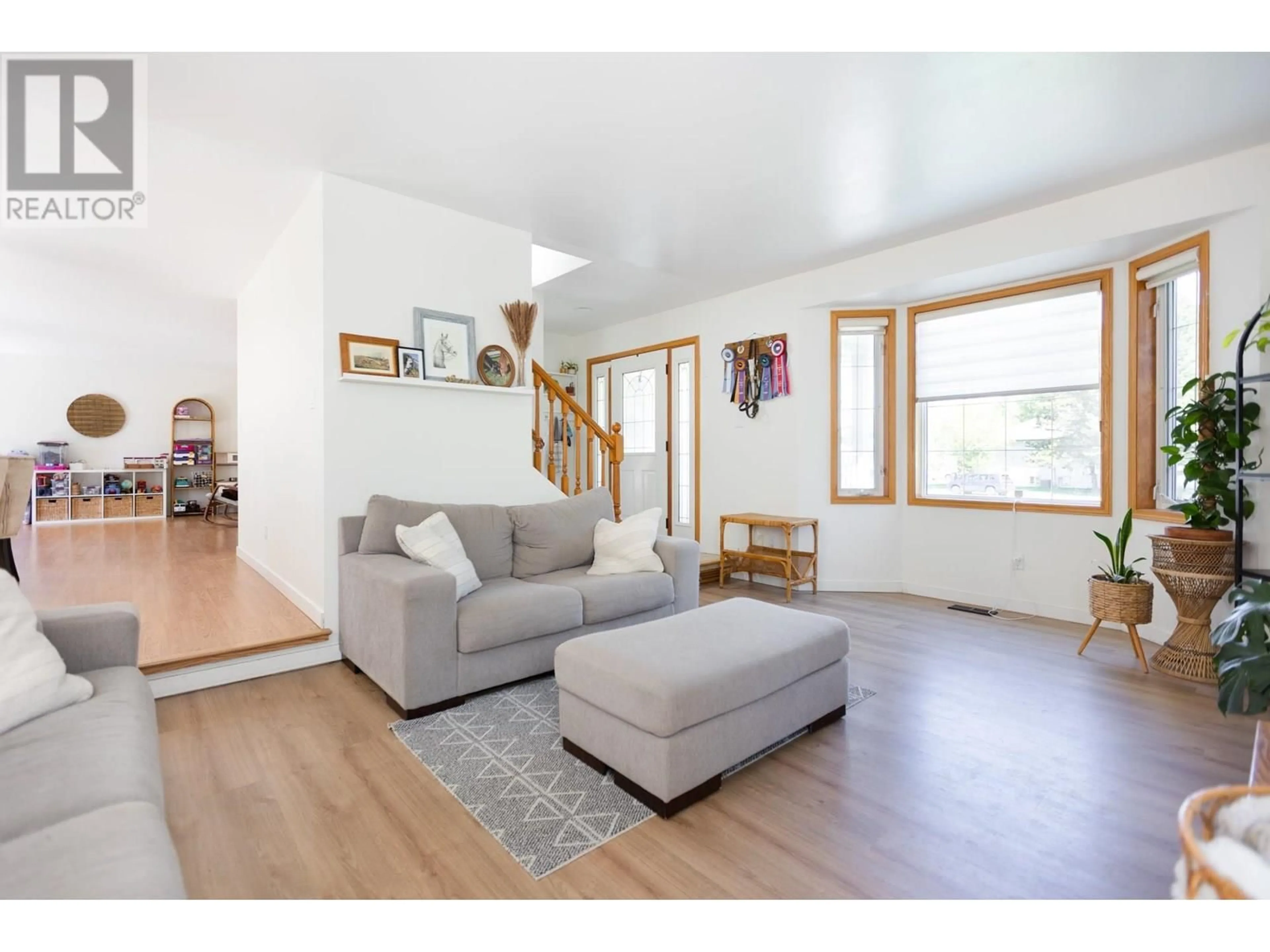 Living room with furniture, wood/laminate floor for 5919 ENNS PLACE, Prince George British Columbia V2K4X3