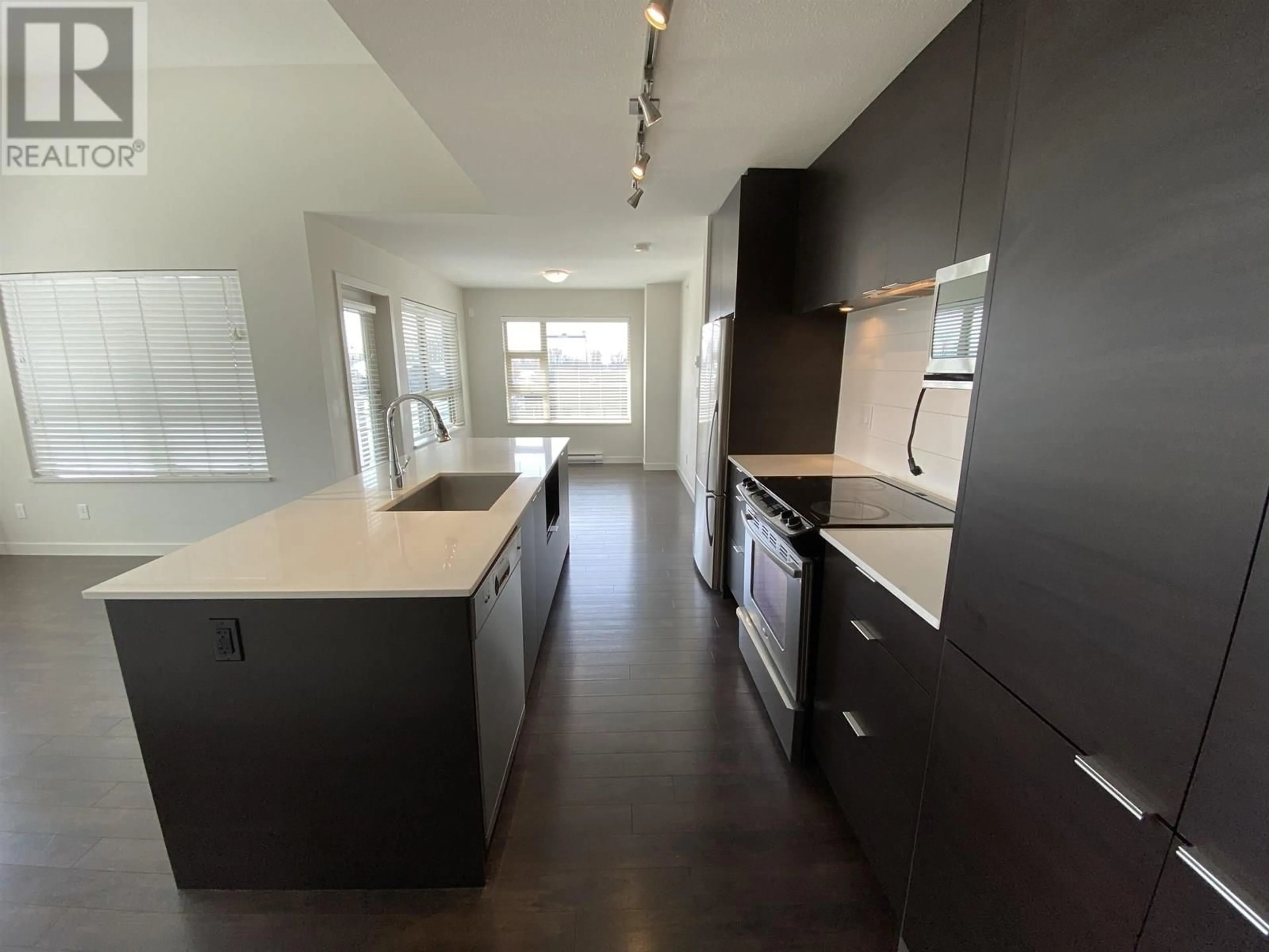 Open concept kitchen, unknown for 509 - 1679 LLOYD AVENUE, North Vancouver British Columbia V7P0A9
