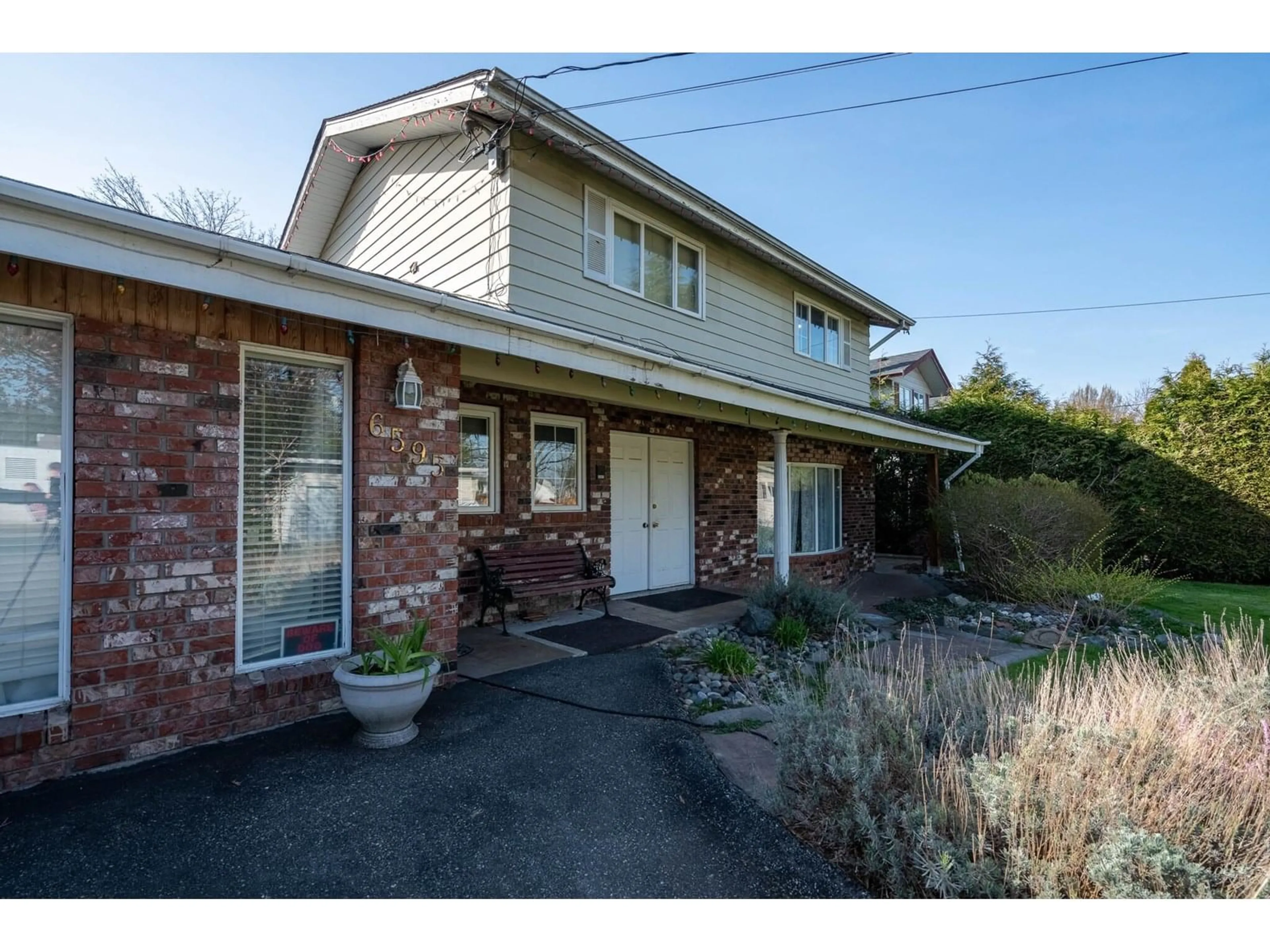 A pic from outside/outdoor area/front of a property/back of a property/a pic from drone, street for 6595 VEDDER ROAD, Chilliwack British Columbia V2R1C9
