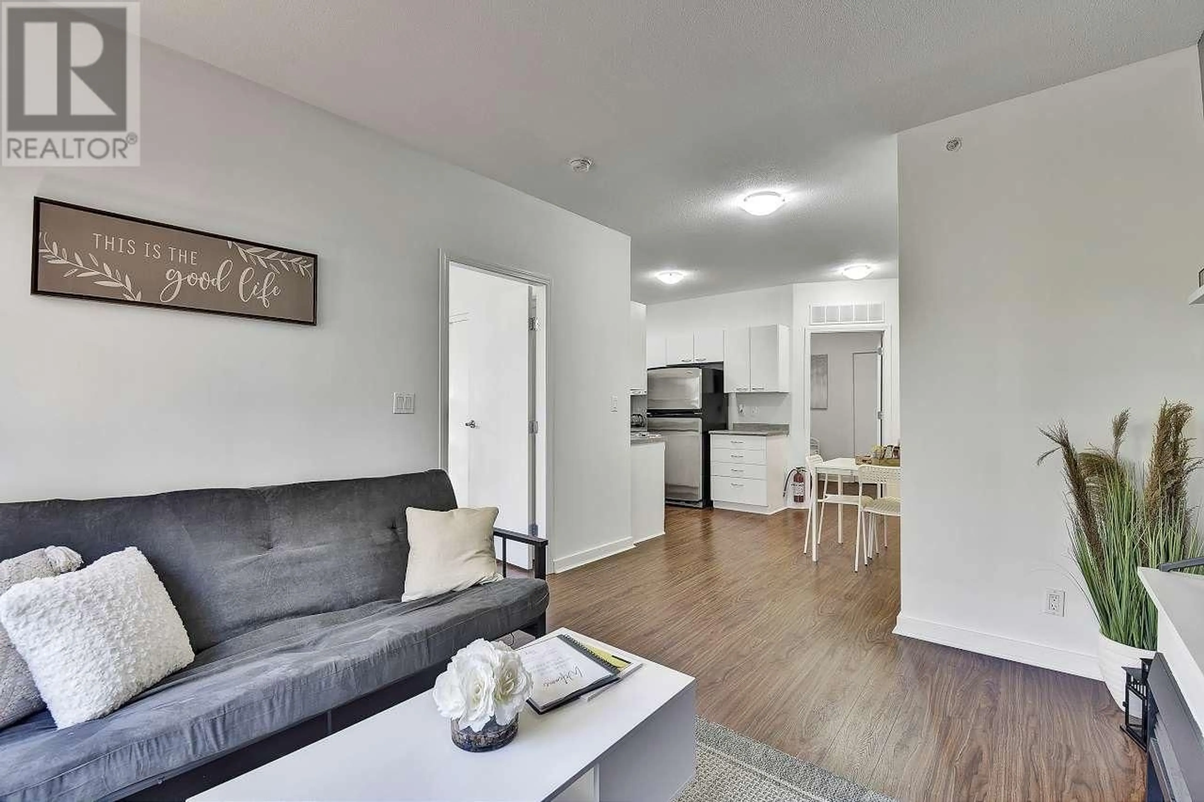 Living room with furniture, wood/laminate floor for 204 - 1249 GRANVILLE STREET, Vancouver British Columbia V6Z1M5
