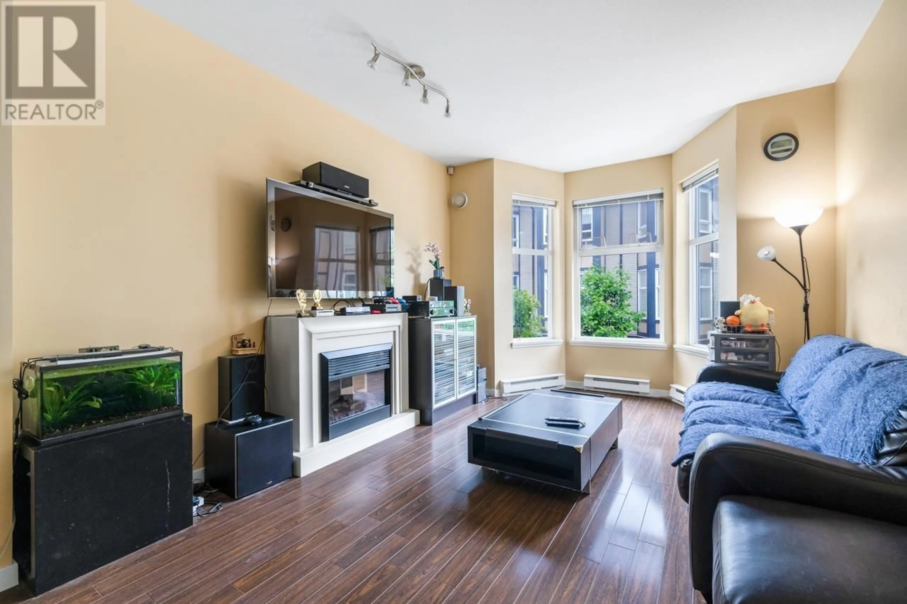 Living room with furniture, wood/laminate floor for 23 - 6099 ALDER STREET, Richmond British Columbia V6Y0A8