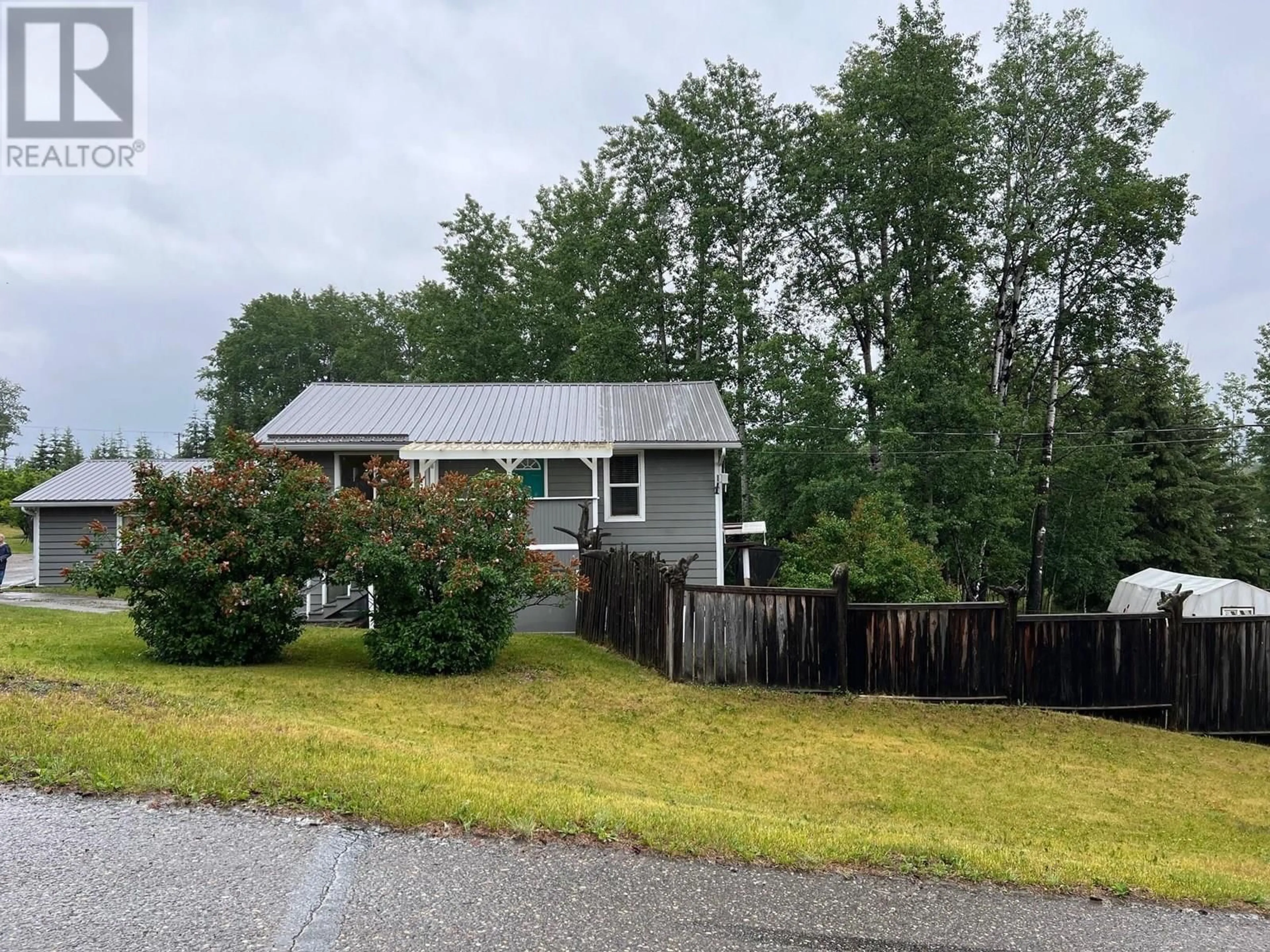 A pic from outside/outdoor area/front of a property/back of a property/a pic from drone, mountain view for 10719 DR GREENE STREET, Hudsons Hope British Columbia V0C1V0