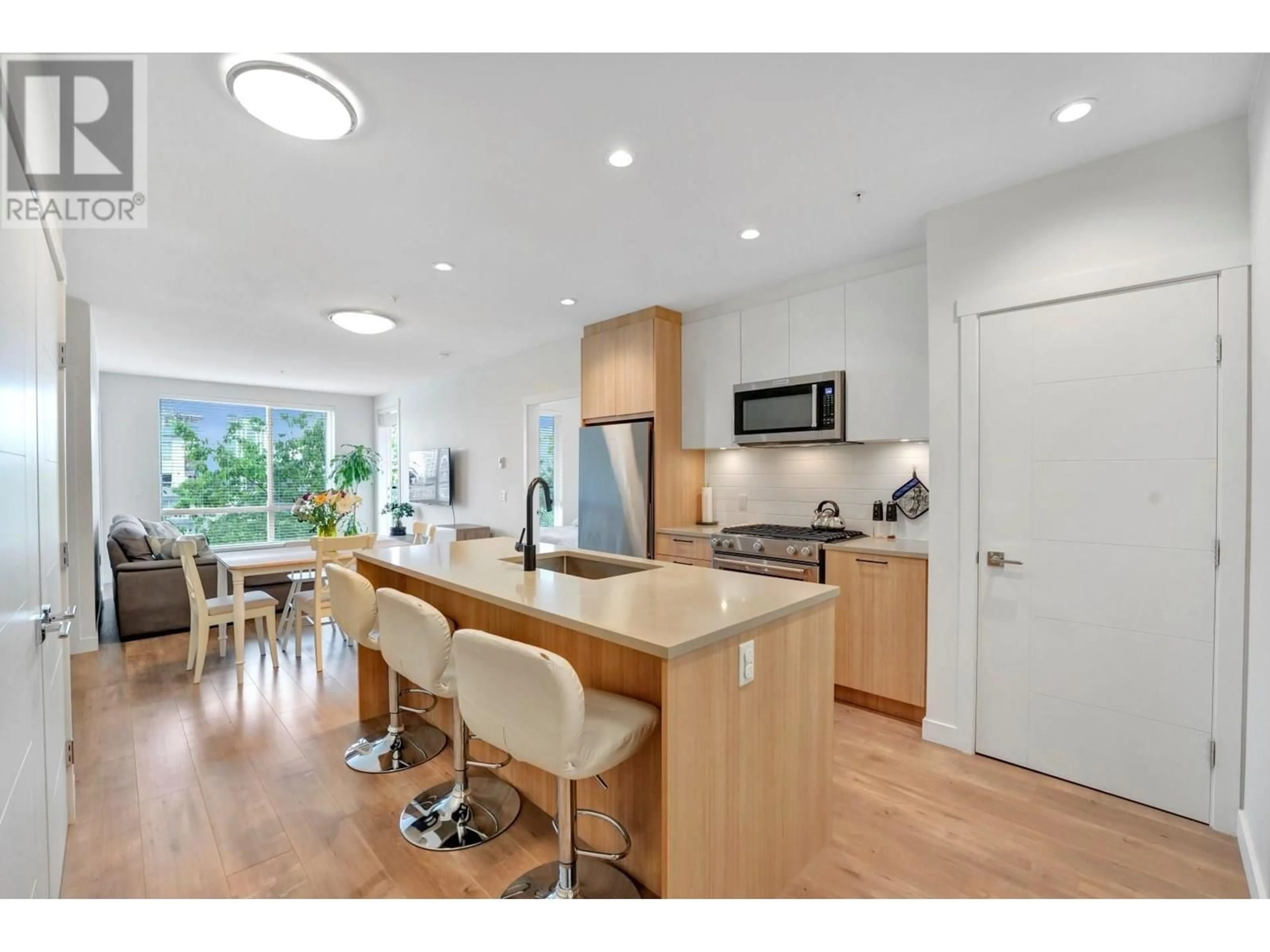 Open concept kitchen, wood/laminate floor for 311 - 707 COMO LAKE AVENUE, Coquitlam British Columbia V3J0J5