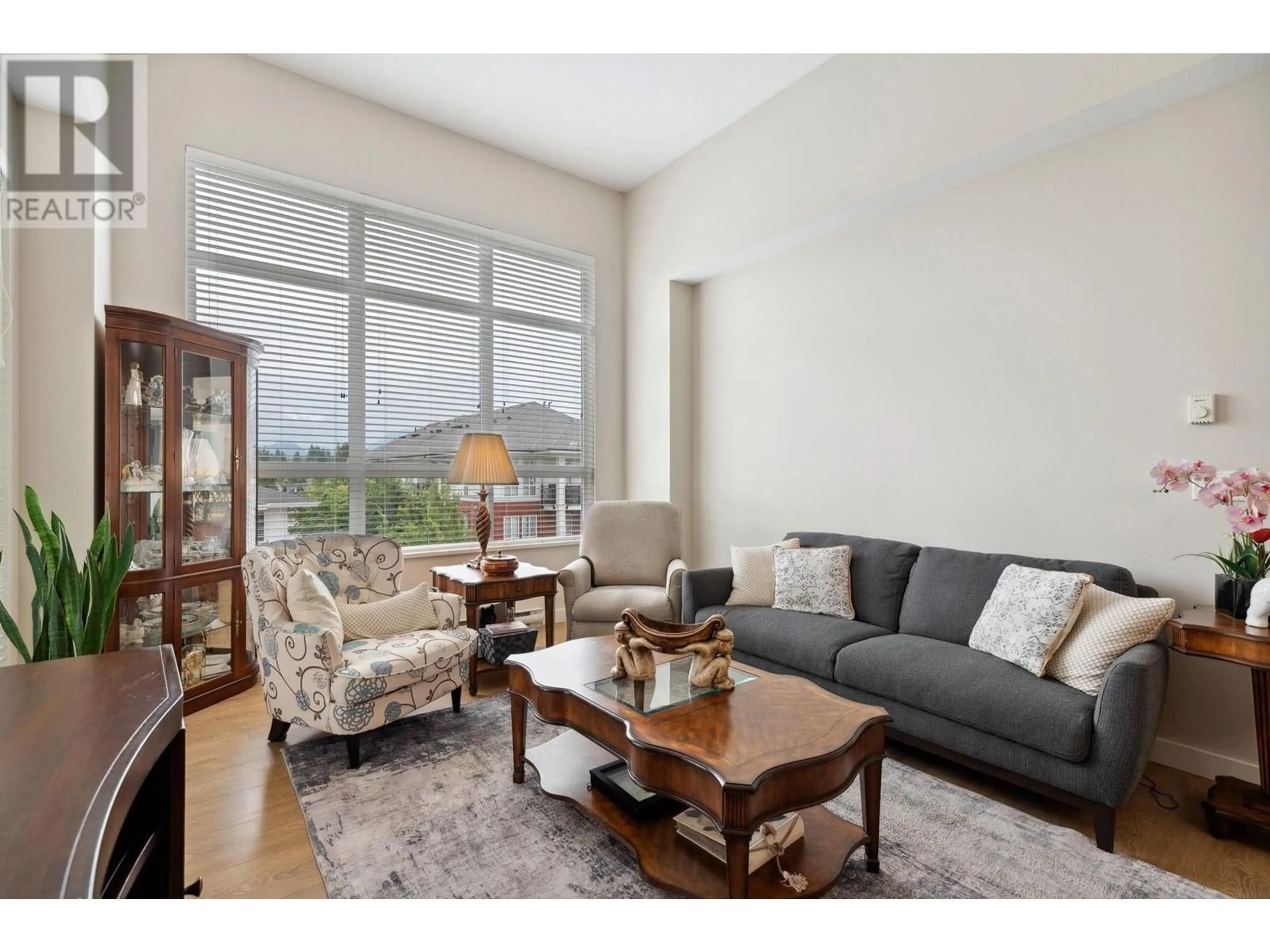 Living room with furniture, wood/laminate floor for 404 - 611 REGAN AVENUE, Coquitlam British Columbia V3J0E5