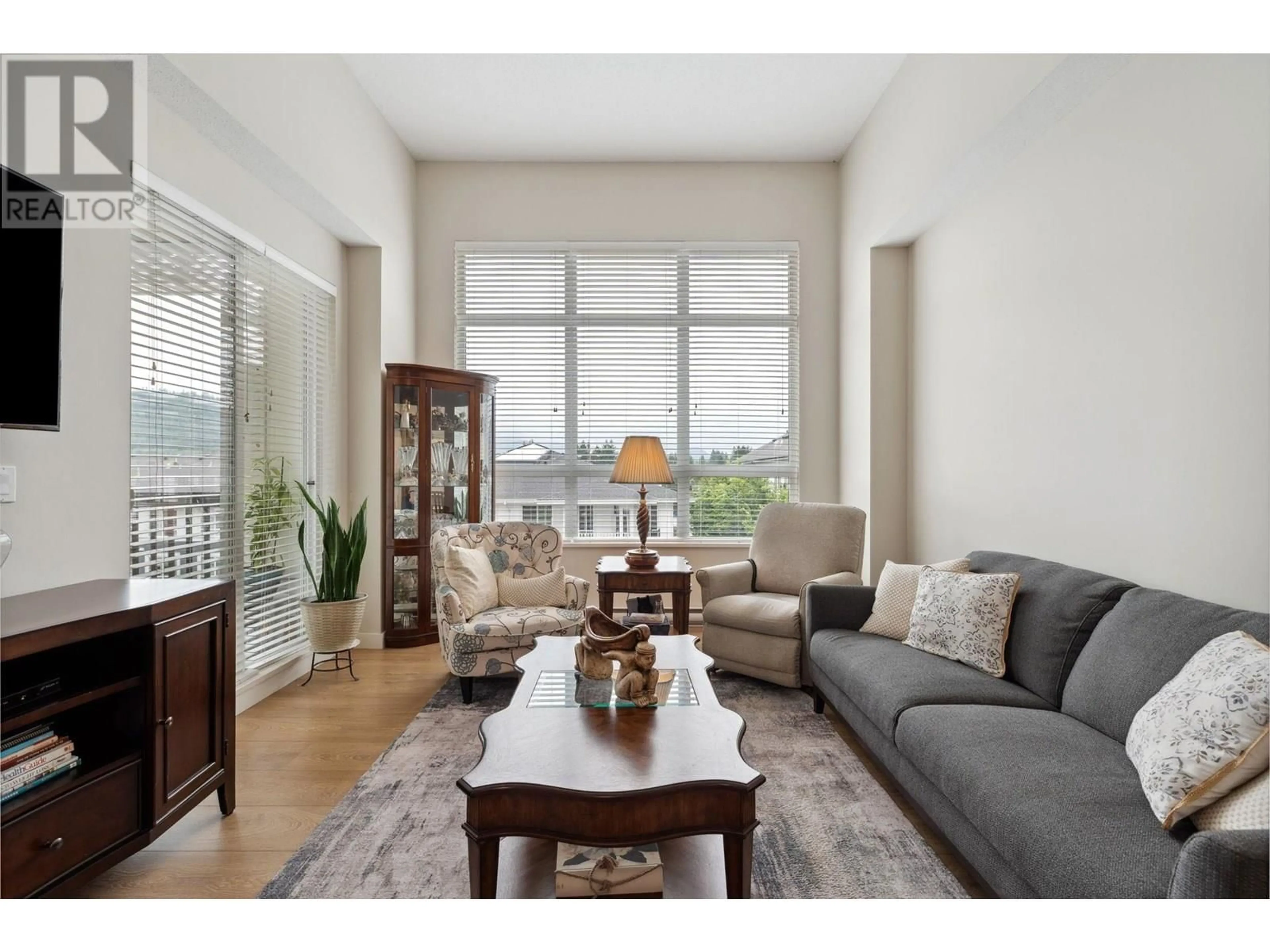 Living room with furniture, wood/laminate floor for 404 - 611 REGAN AVENUE, Coquitlam British Columbia V3J0E5