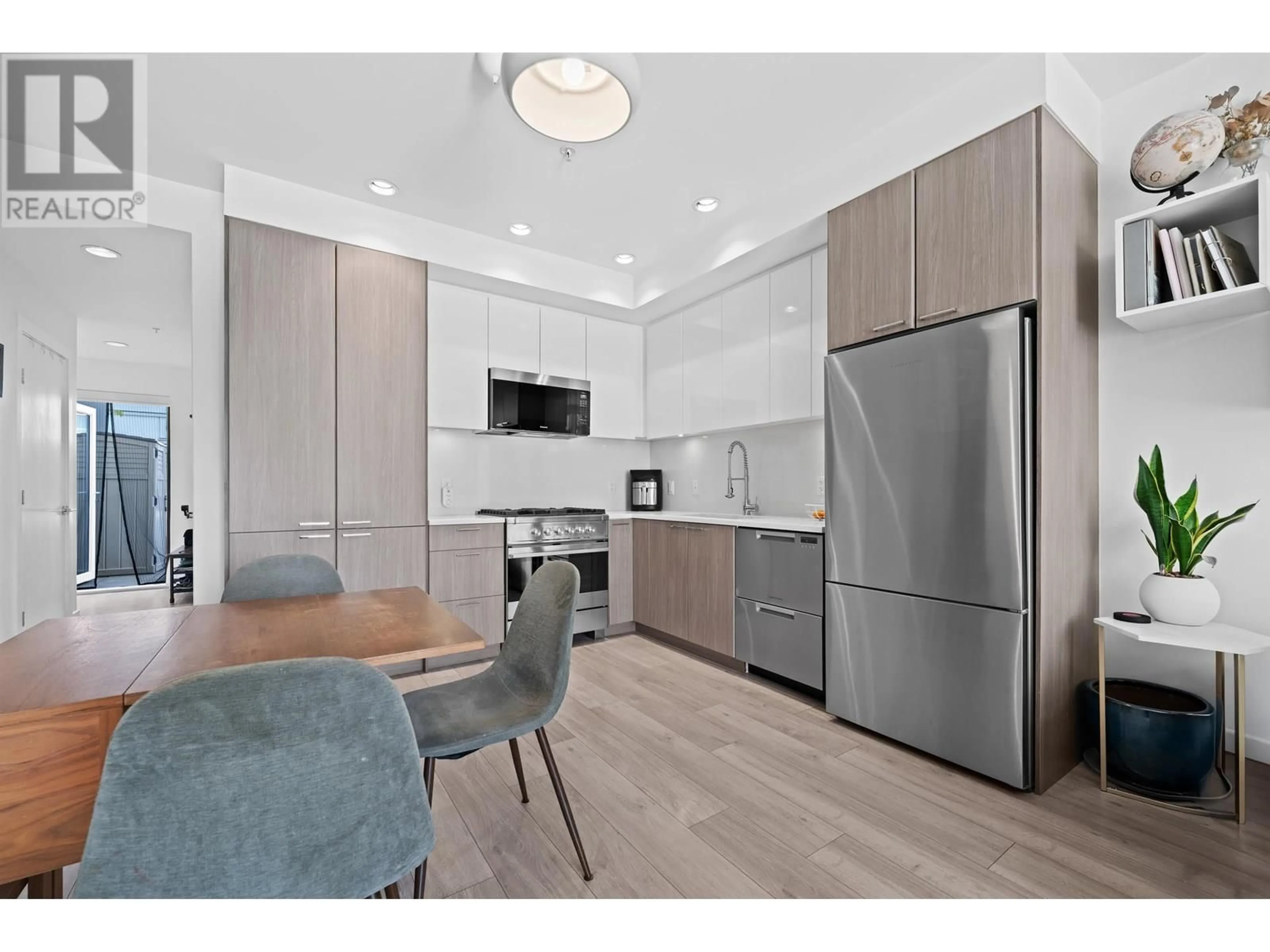 Open concept kitchen, wood/laminate floor for 201 - 3420 ST. CATHERINES STREET, Vancouver British Columbia V5V3C4