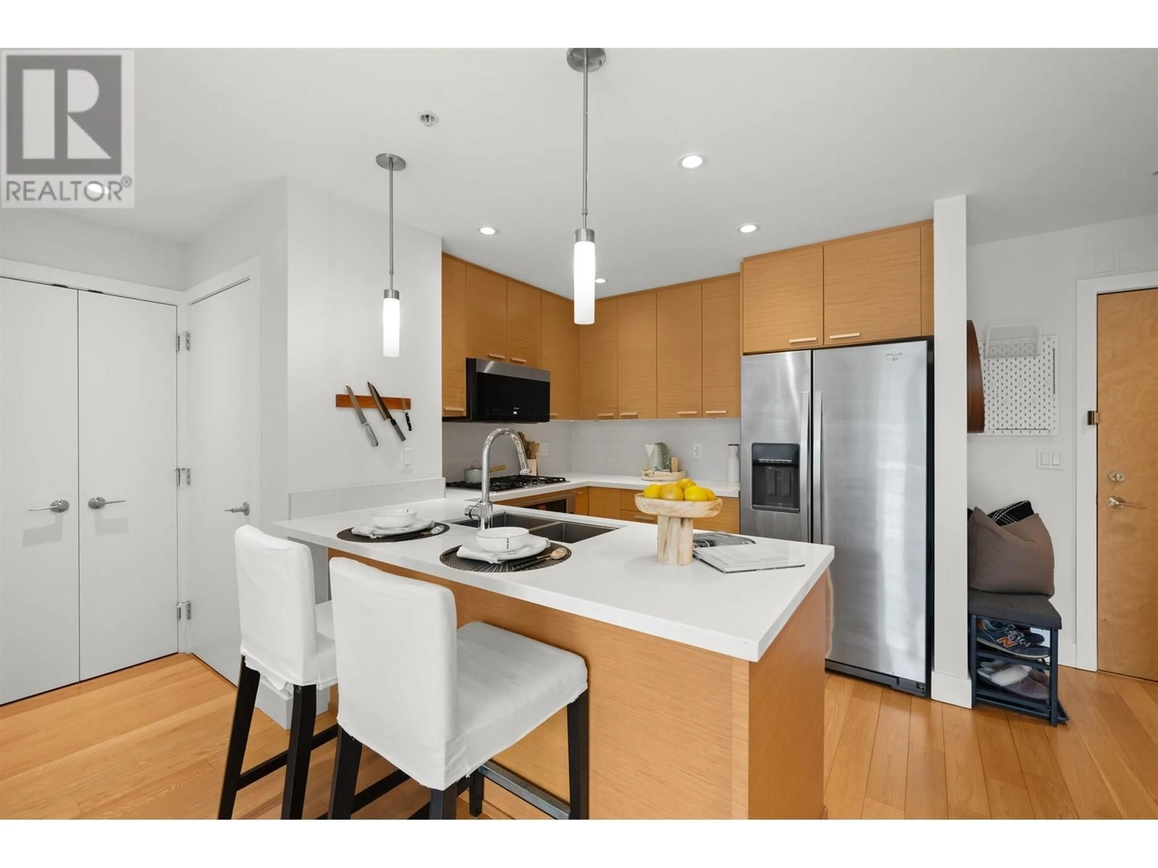 Open concept kitchen, wood/laminate floor for 206 - 2020 ALMA STREET, Vancouver British Columbia V6R3P9