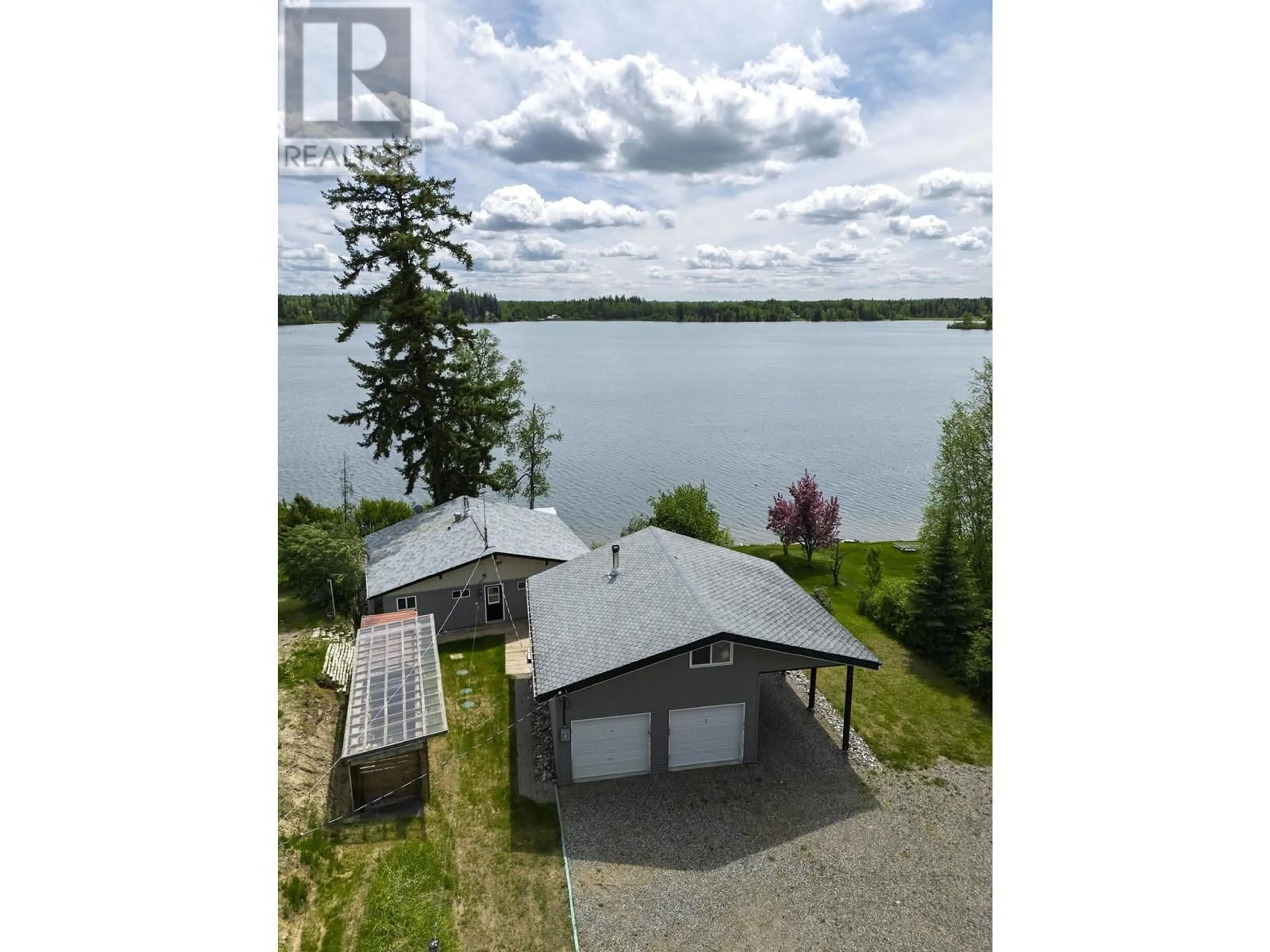 A pic from outside/outdoor area/front of a property/back of a property/a pic from drone, water/lake/river/ocean view for 25785 NESS LAKE ROAD, Prince George British Columbia V2K5N3