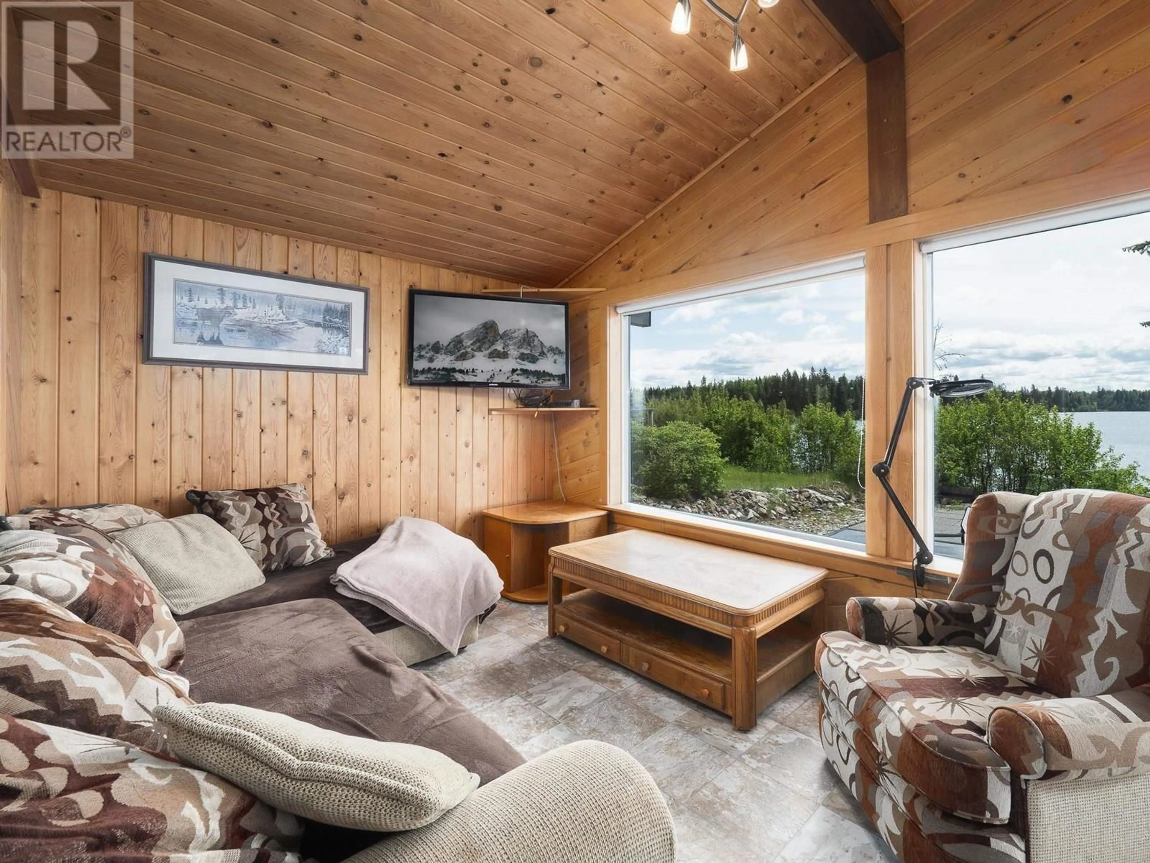 Living room with furniture, wood/laminate floor for 25785 NESS LAKE ROAD, Prince George British Columbia V2K5N3