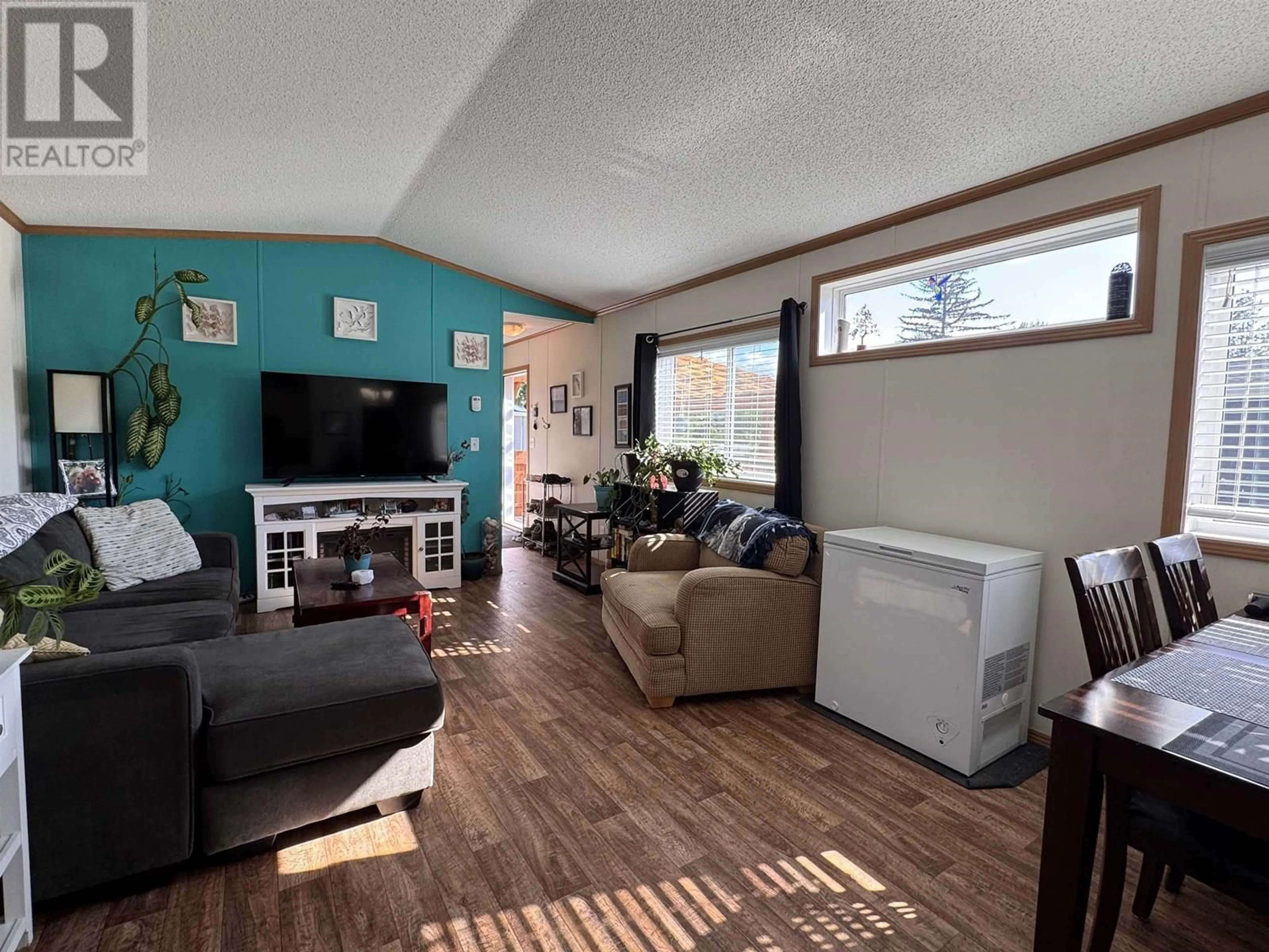 Living room with furniture, wood/laminate floor for 27 - 5204 ACKROYD STREET, Terrace British Columbia V8G1E6