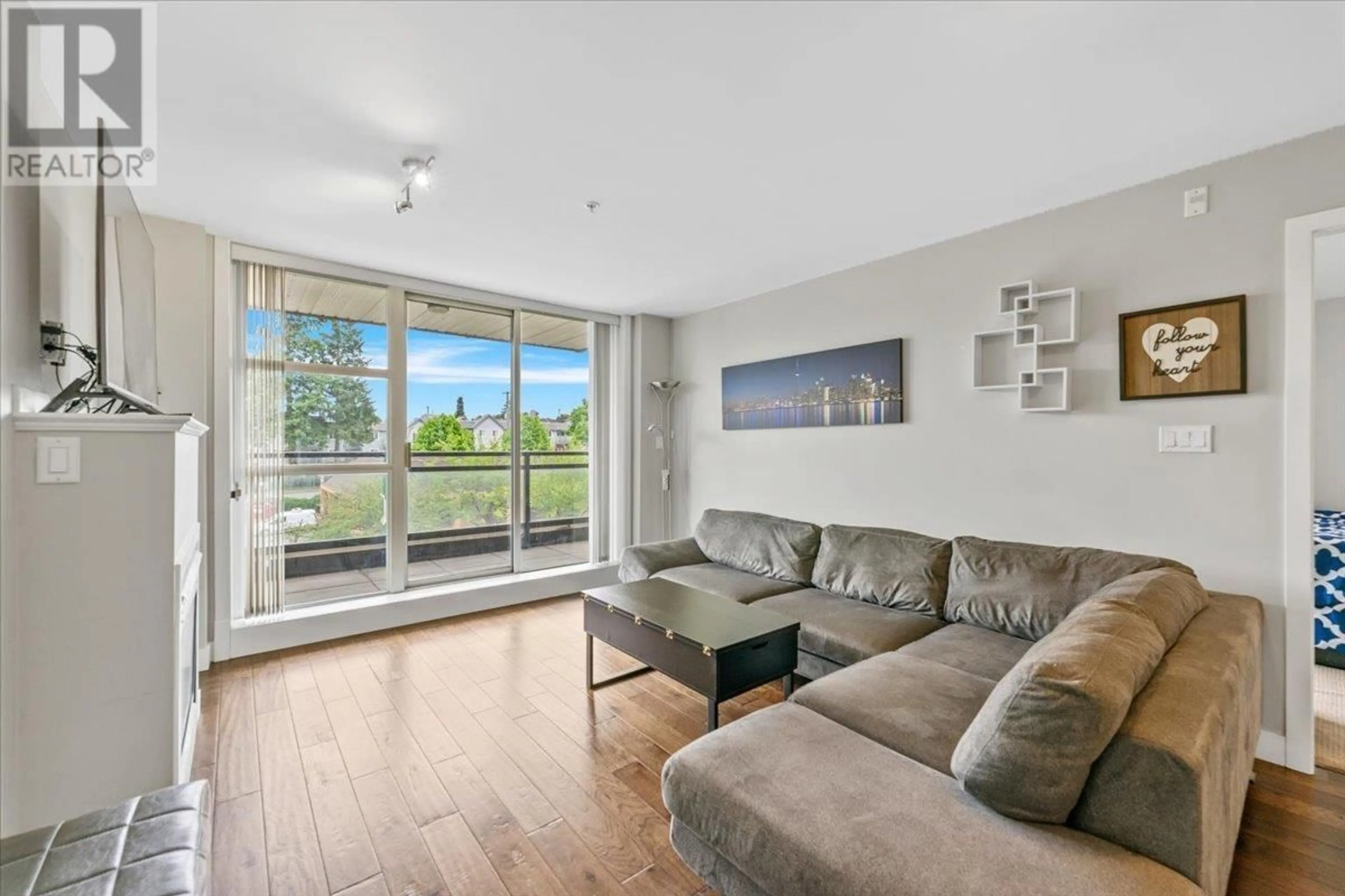 Living room with furniture, wood/laminate floor for 409 - 3255 SMITH AVENUE, Burnaby British Columbia V5G0B5