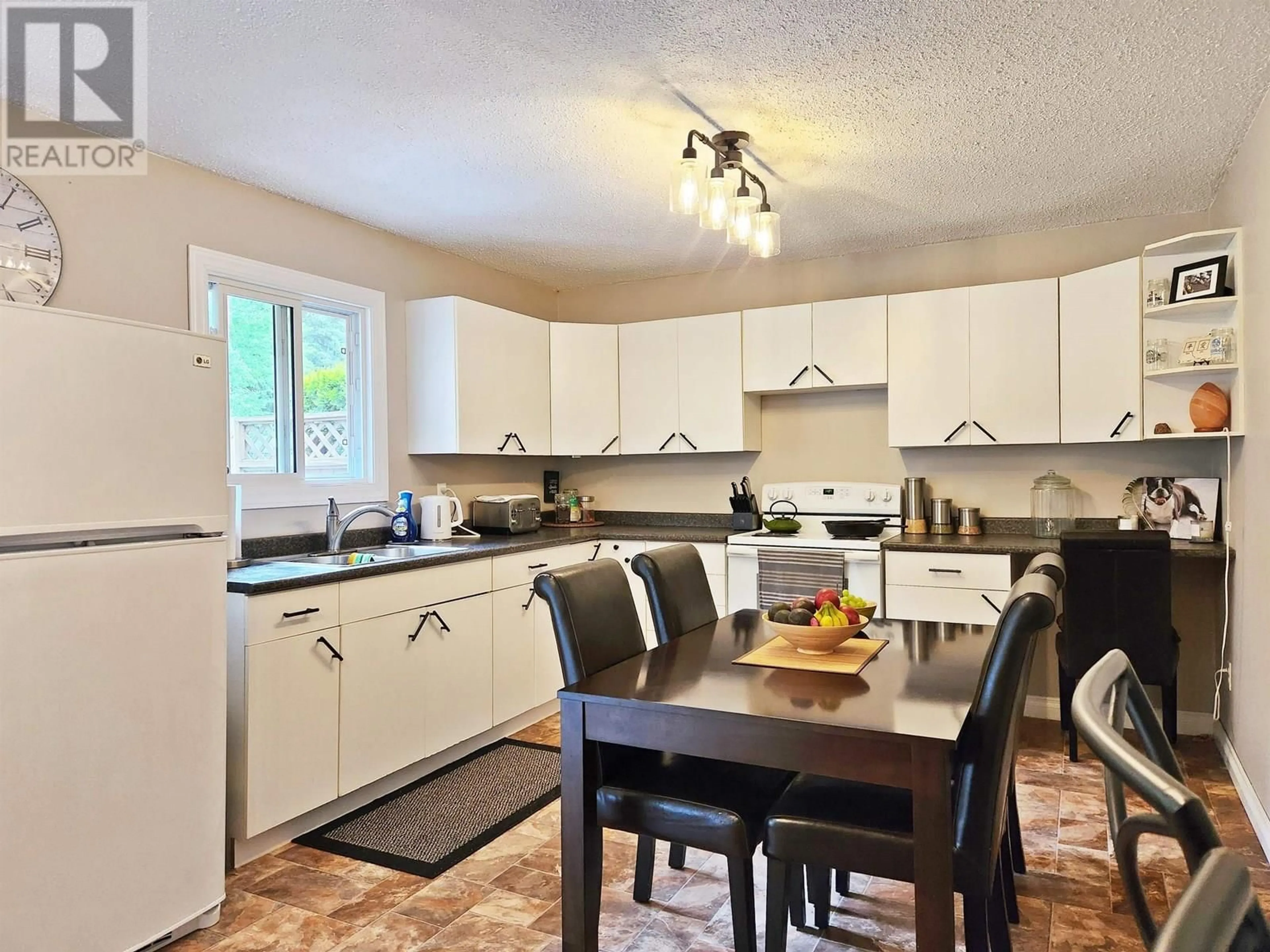 Open concept kitchen, wood/laminate floor for 2838 BLACKWATER ROAD, Quesnel British Columbia V2J7C9
