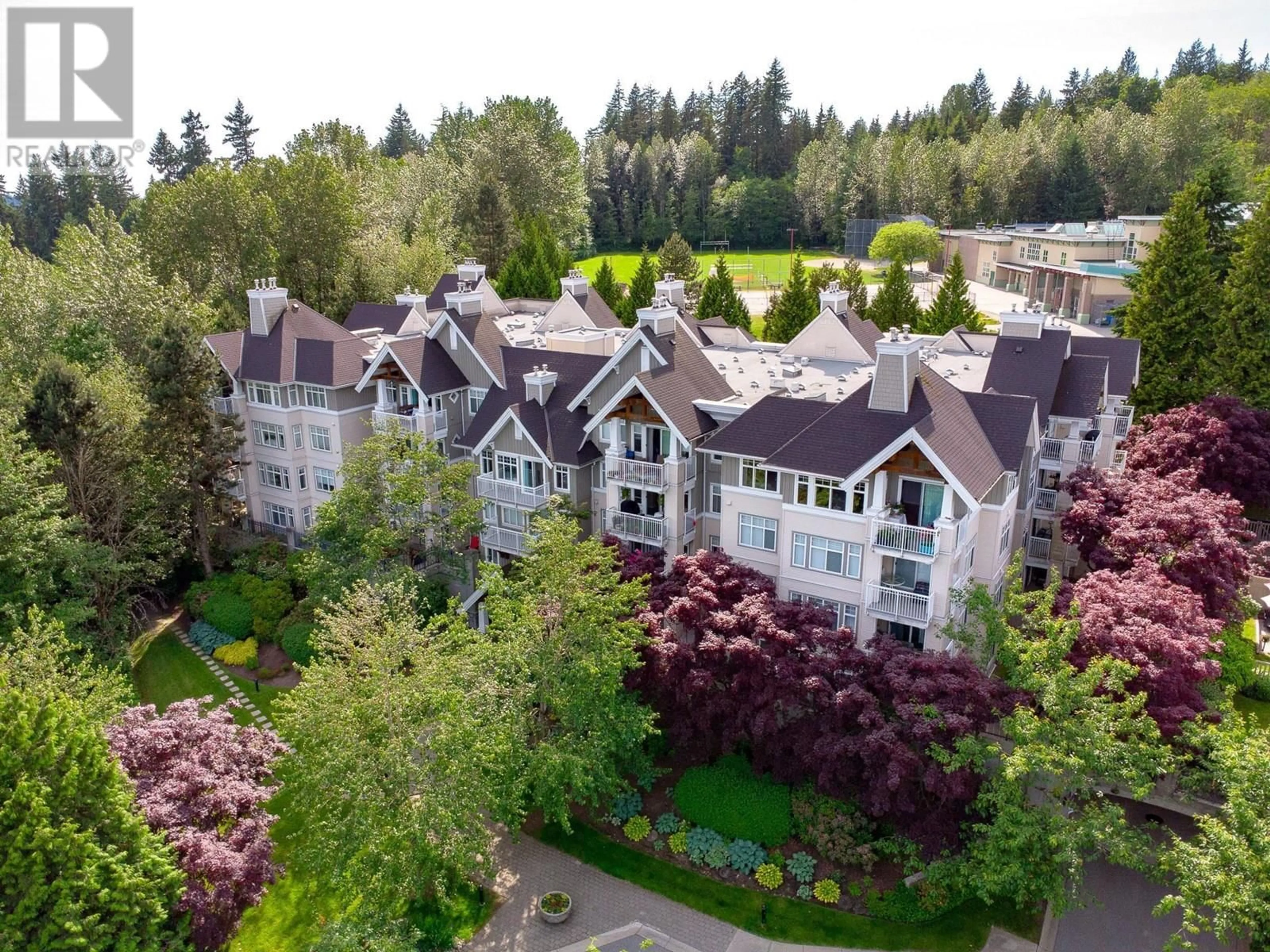 A pic from outside/outdoor area/front of a property/back of a property/a pic from drone, unknown for 102 - 1438 PARKWAY BOULEVARD, Coquitlam British Columbia V3E3M1