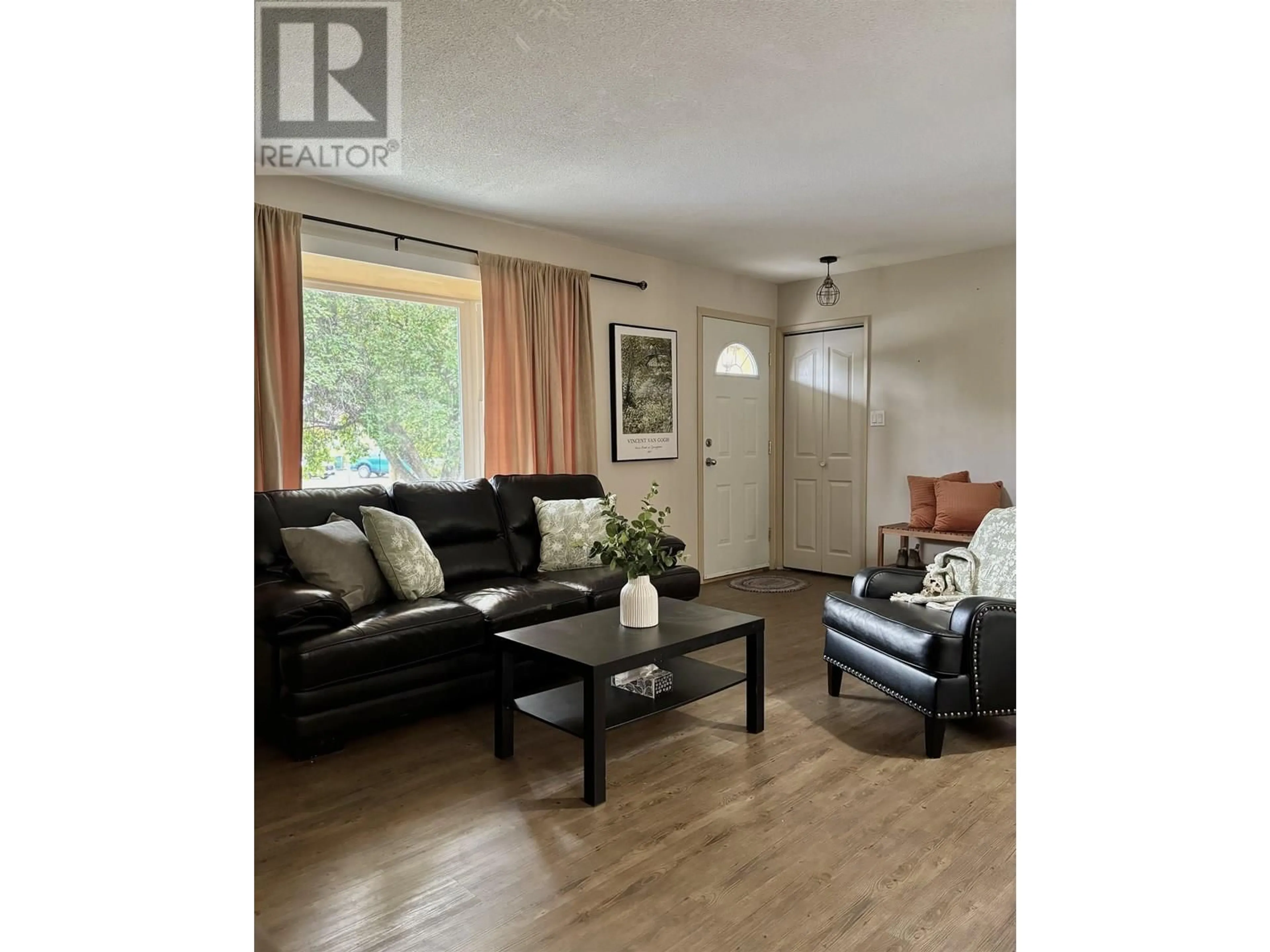 Living room with furniture, wood/laminate floor for 1130 LATIN AVENUE, Williams Lake British Columbia V2G2J9