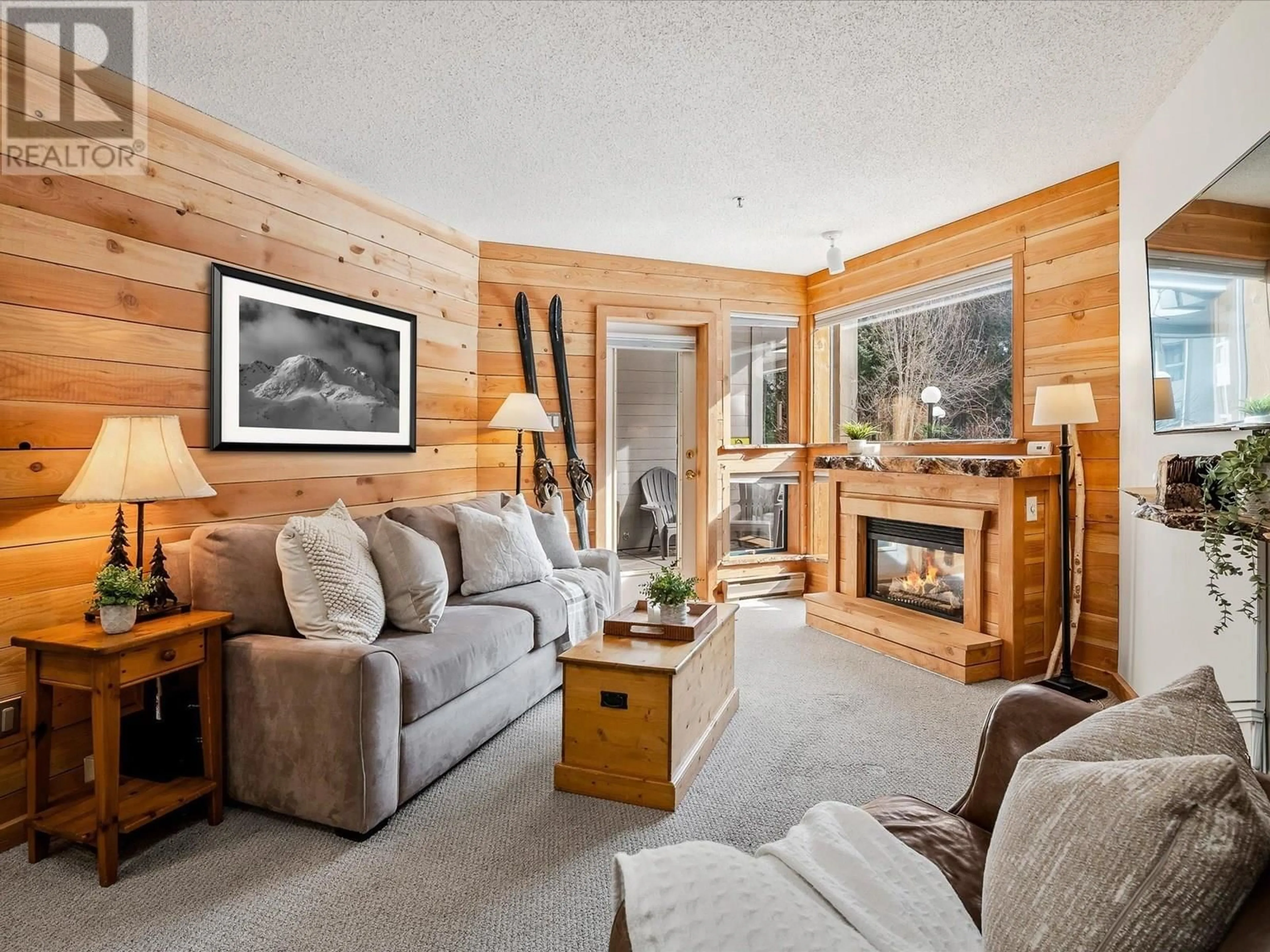 Living room with furniture, wood/laminate floor for 229 - 4905 SPEARHEAD DRIVE, Whistler British Columbia V0N1B4