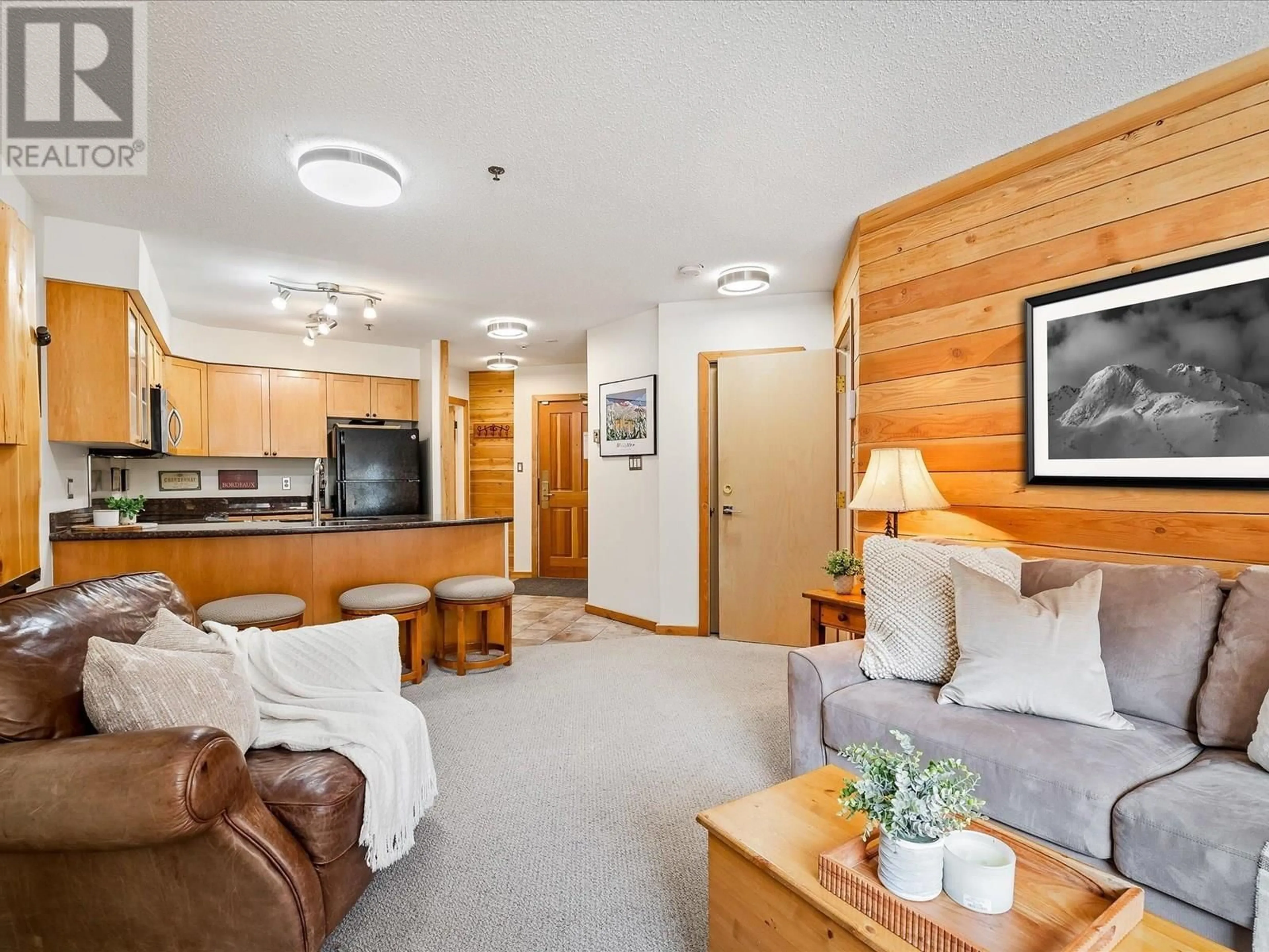 Living room with furniture, wood/laminate floor for 229 - 4905 SPEARHEAD DRIVE, Whistler British Columbia V0N1B4