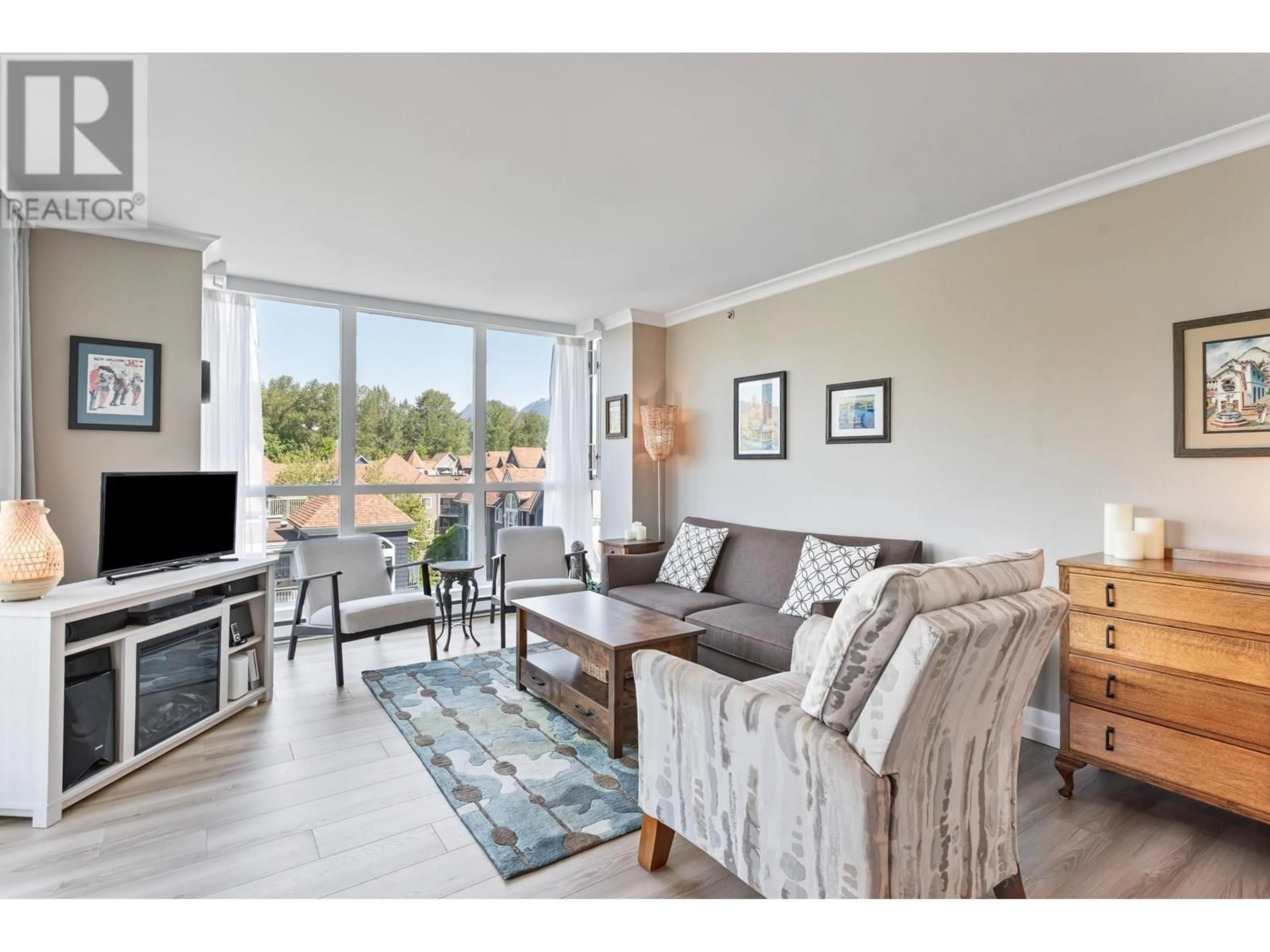 Living room with furniture, wood/laminate floor for 601 - 3071 GLEN DRIVE, Coquitlam British Columbia V3B7R1
