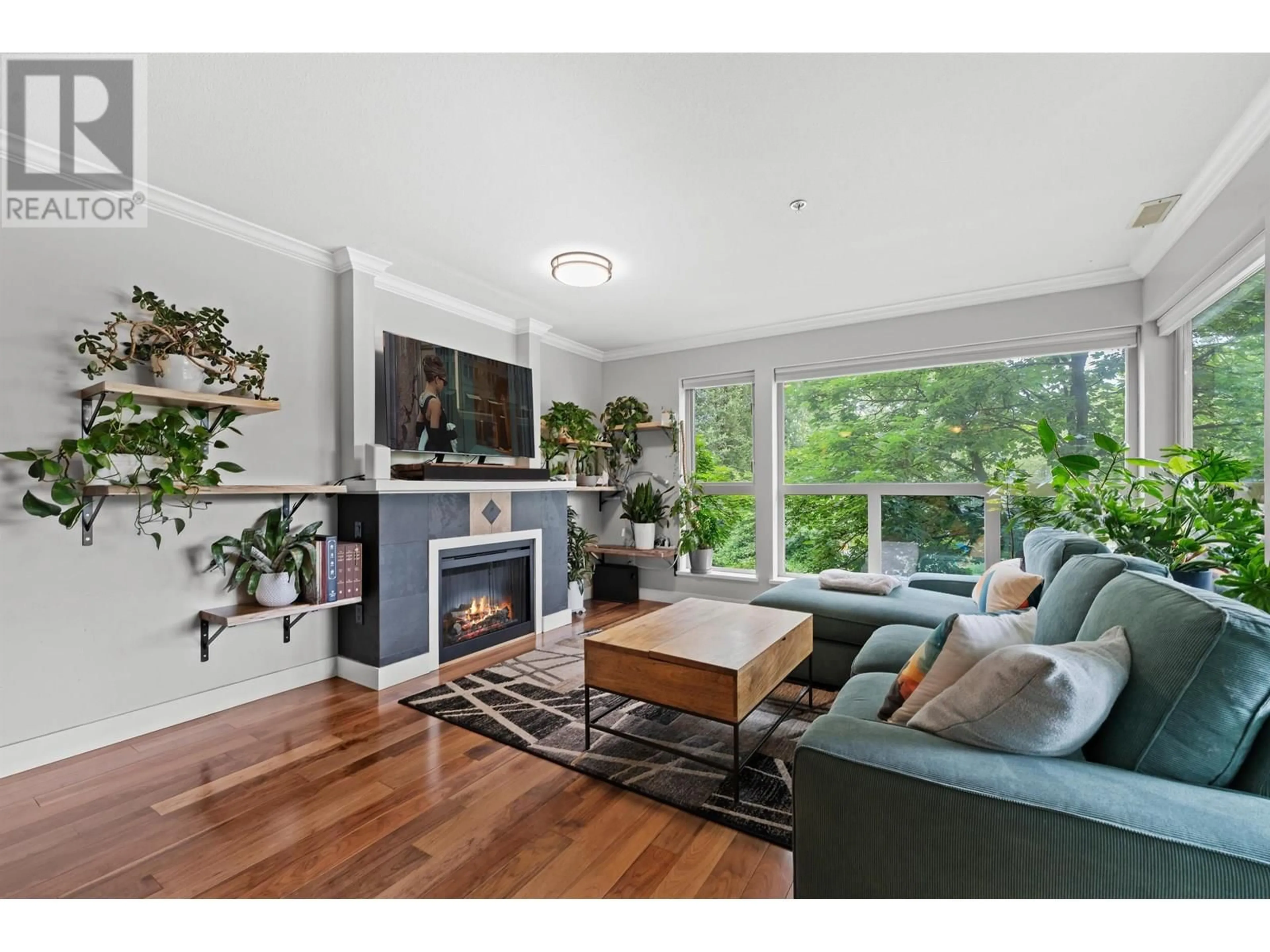 Living room with furniture, wood/laminate floor for 209 - 801 KLAHANIE DRIVE, Port Moody British Columbia V3H5K4