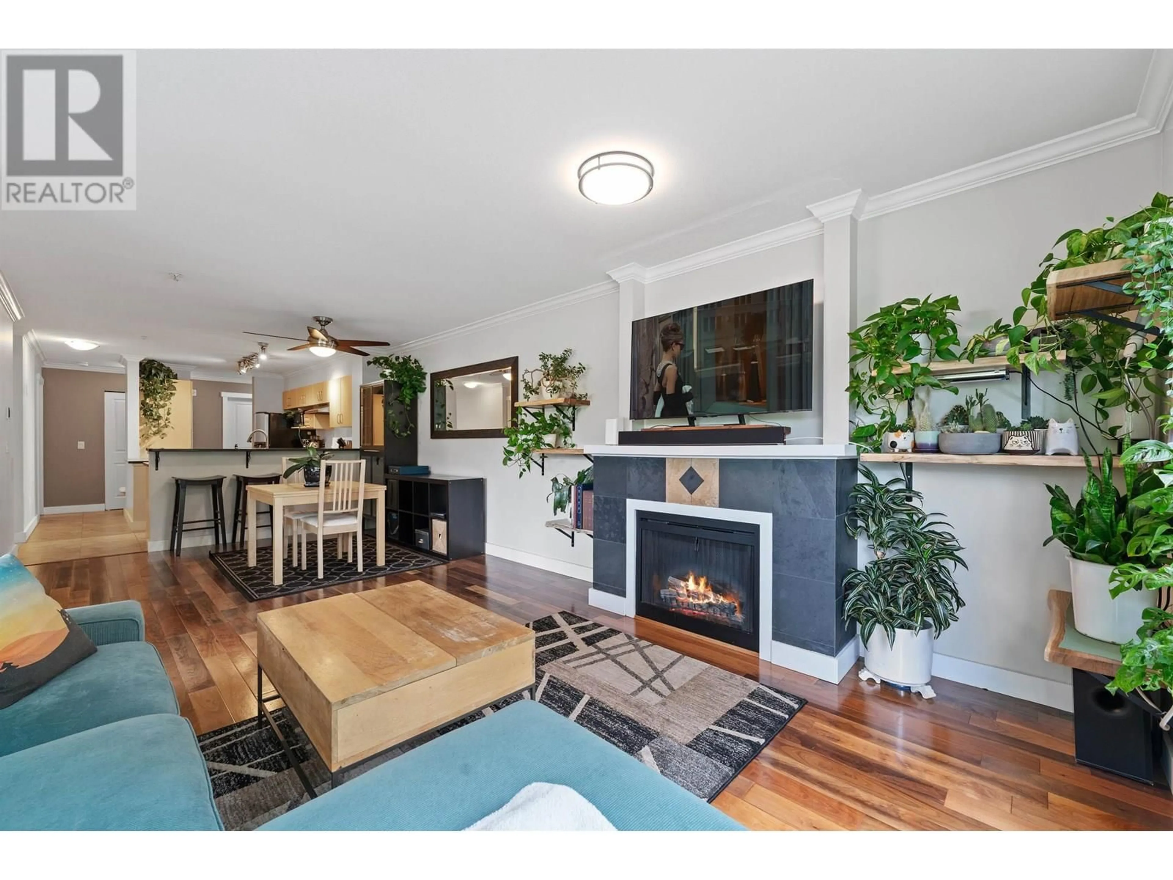 Living room with furniture, wood/laminate floor for 209 - 801 KLAHANIE DRIVE, Port Moody British Columbia V3H5K4