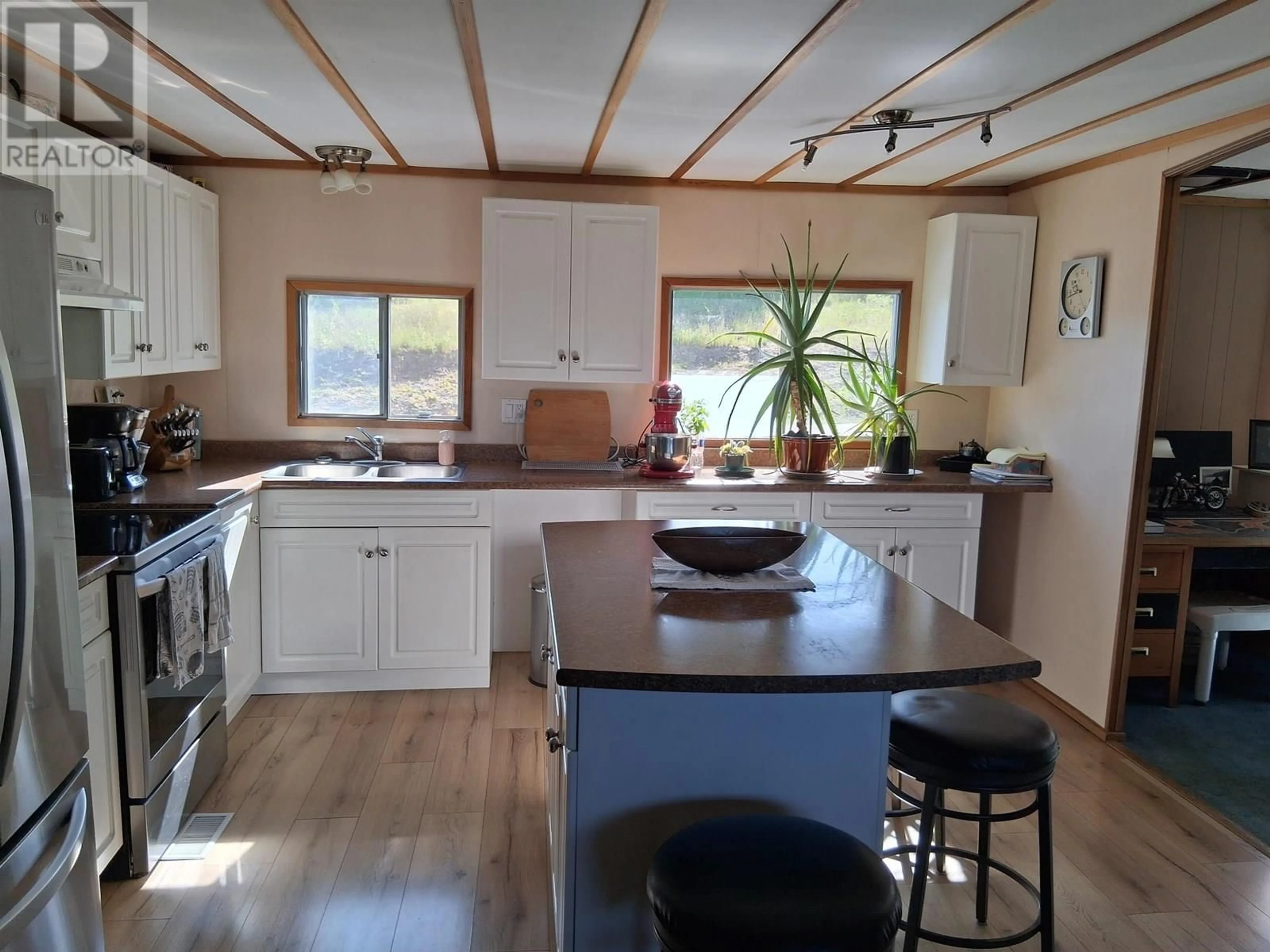Open concept kitchen, wood/laminate floor for 2978 FIELDING STREET, Hazelton British Columbia V0J2J0