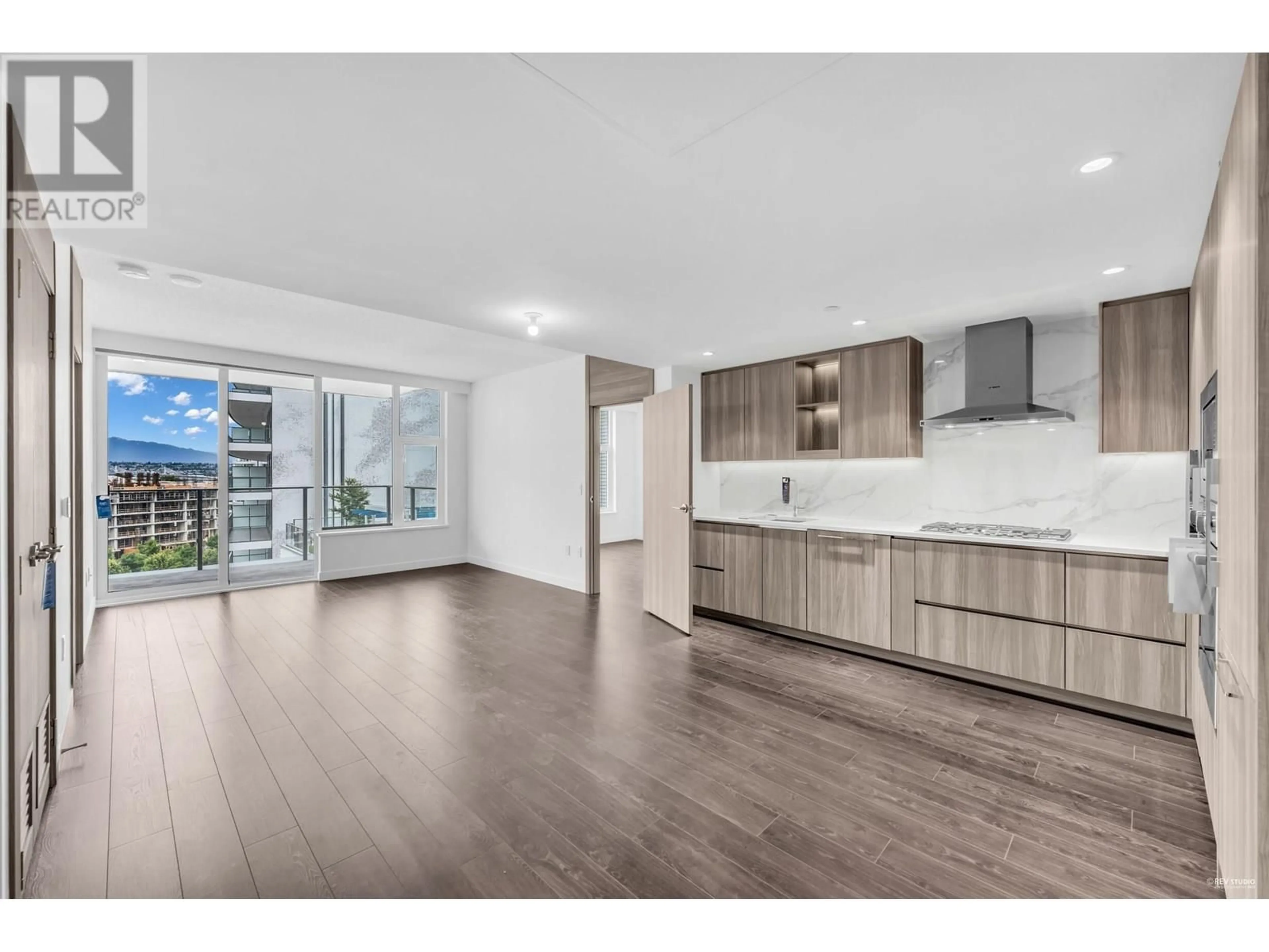 Open concept kitchen, wood/laminate floor for 815 - 8611 HAZELBRIDGE WAY, Richmond British Columbia V6X0W8