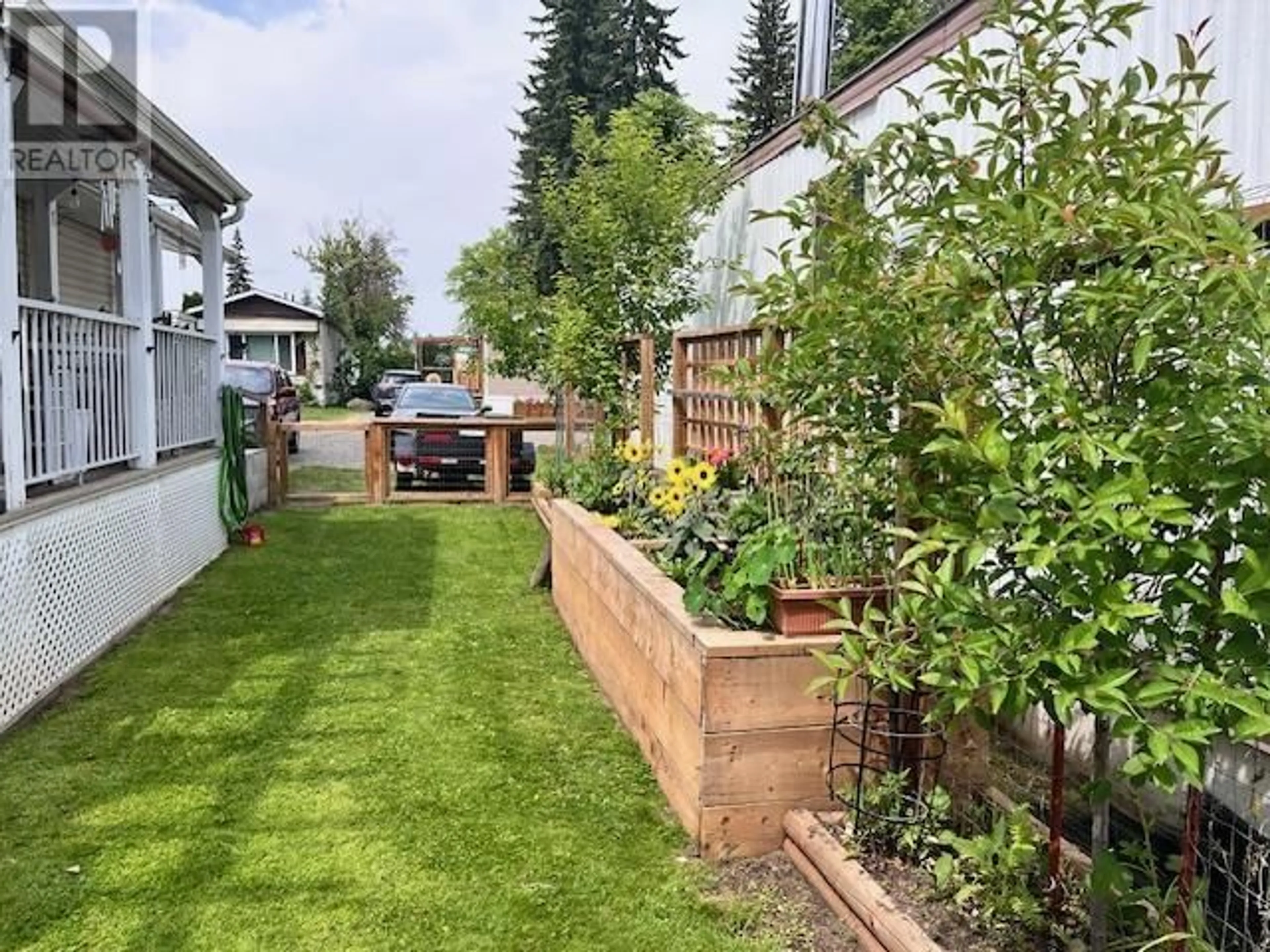 A pic from outside/outdoor area/front of a property/back of a property/a pic from drone, street for 22 - 564 NORTH FRASER DRIVE, Quesnel British Columbia V2J1Z6