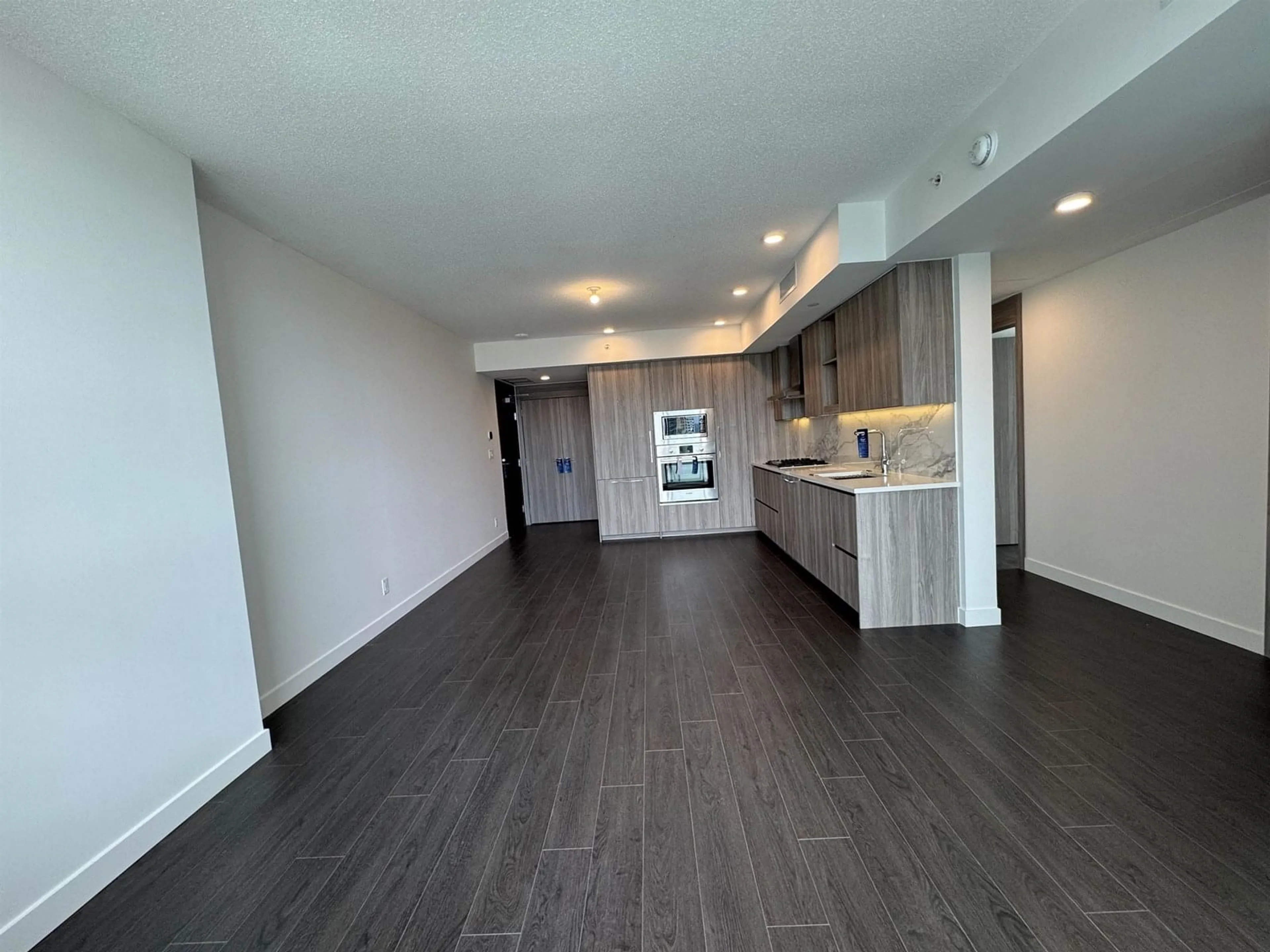 Open concept kitchen, wood/laminate floor for 2409 - 13768 100, Surrey British Columbia V3T0V2