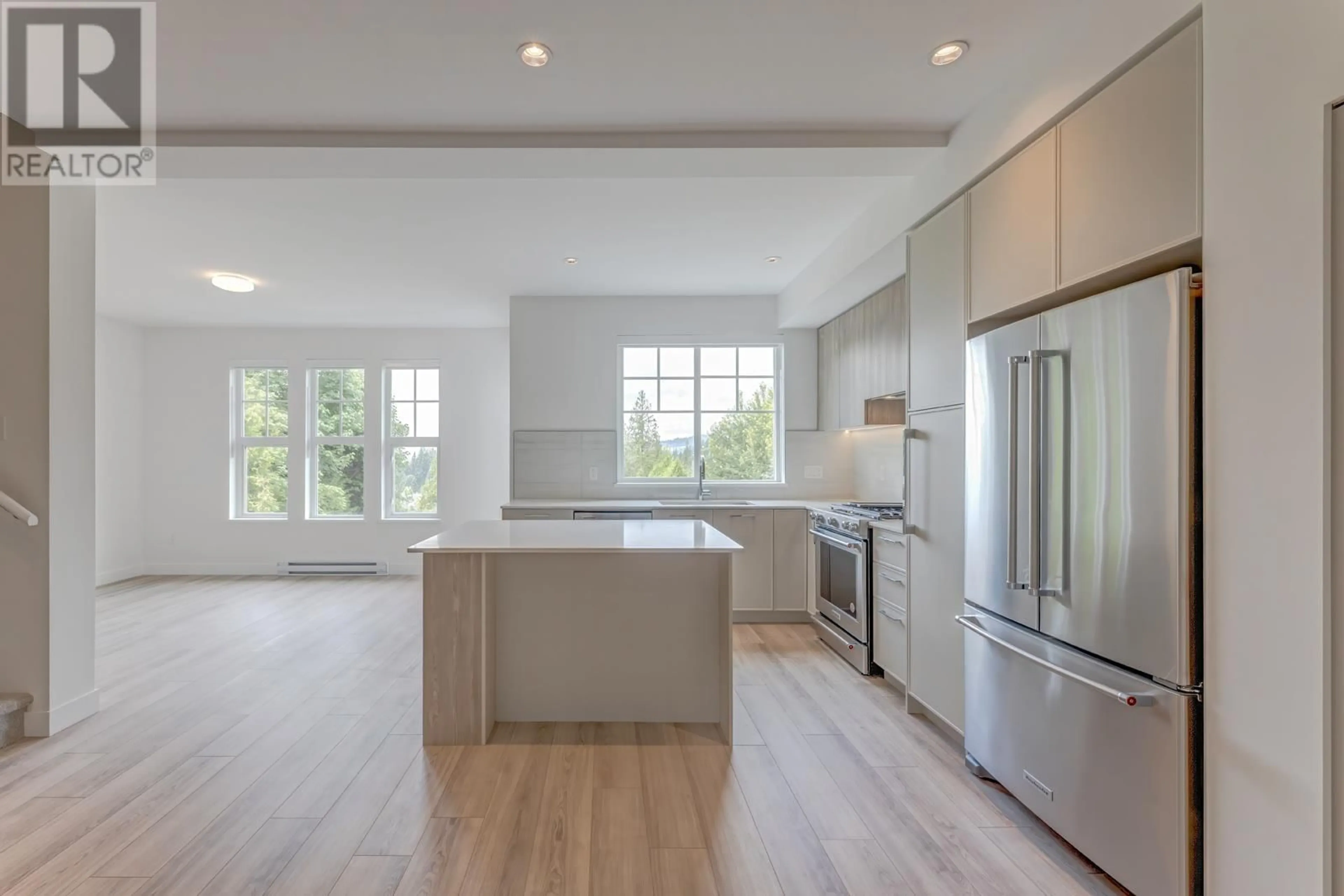 Open concept kitchen, wood/laminate floor for 104 - 3421 QUEENSTON AVENUE, Coquitlam British Columbia V3E0V9