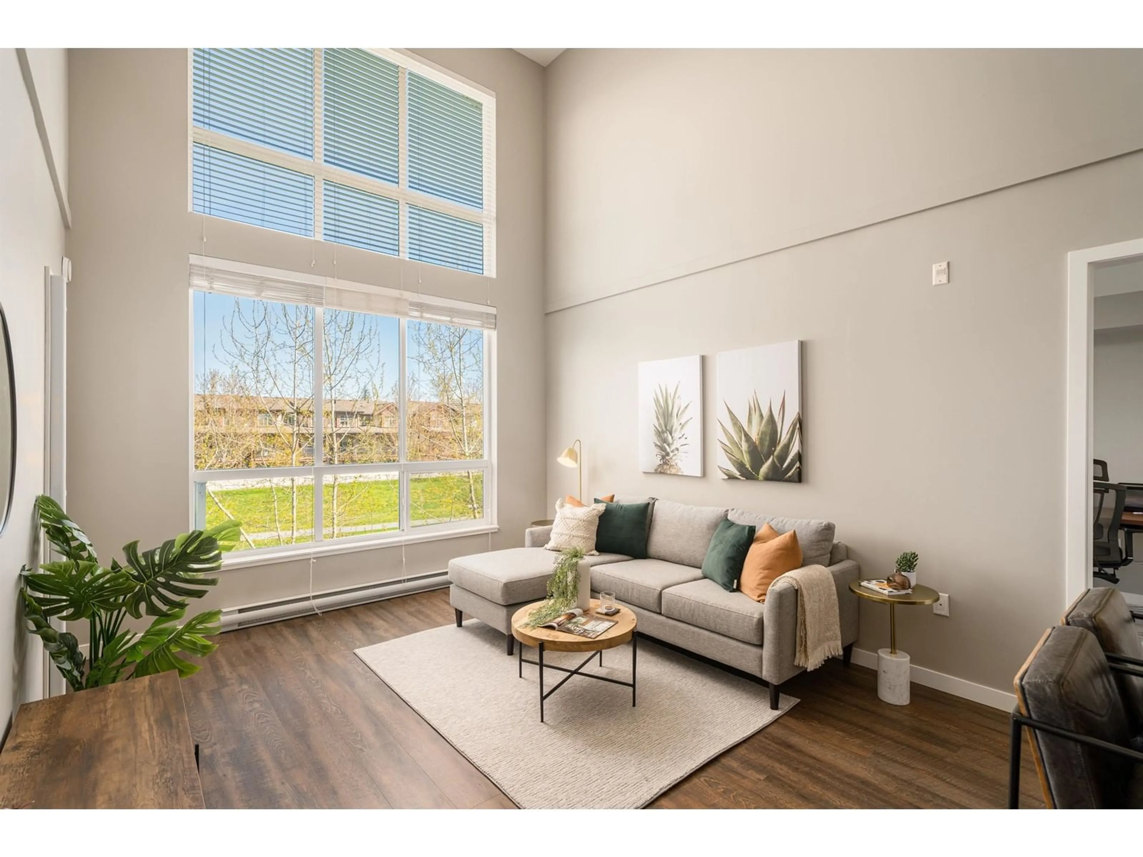 Living room with furniture, wood/laminate floor for 406 - 6490 194, Surrey British Columbia V4N6J9